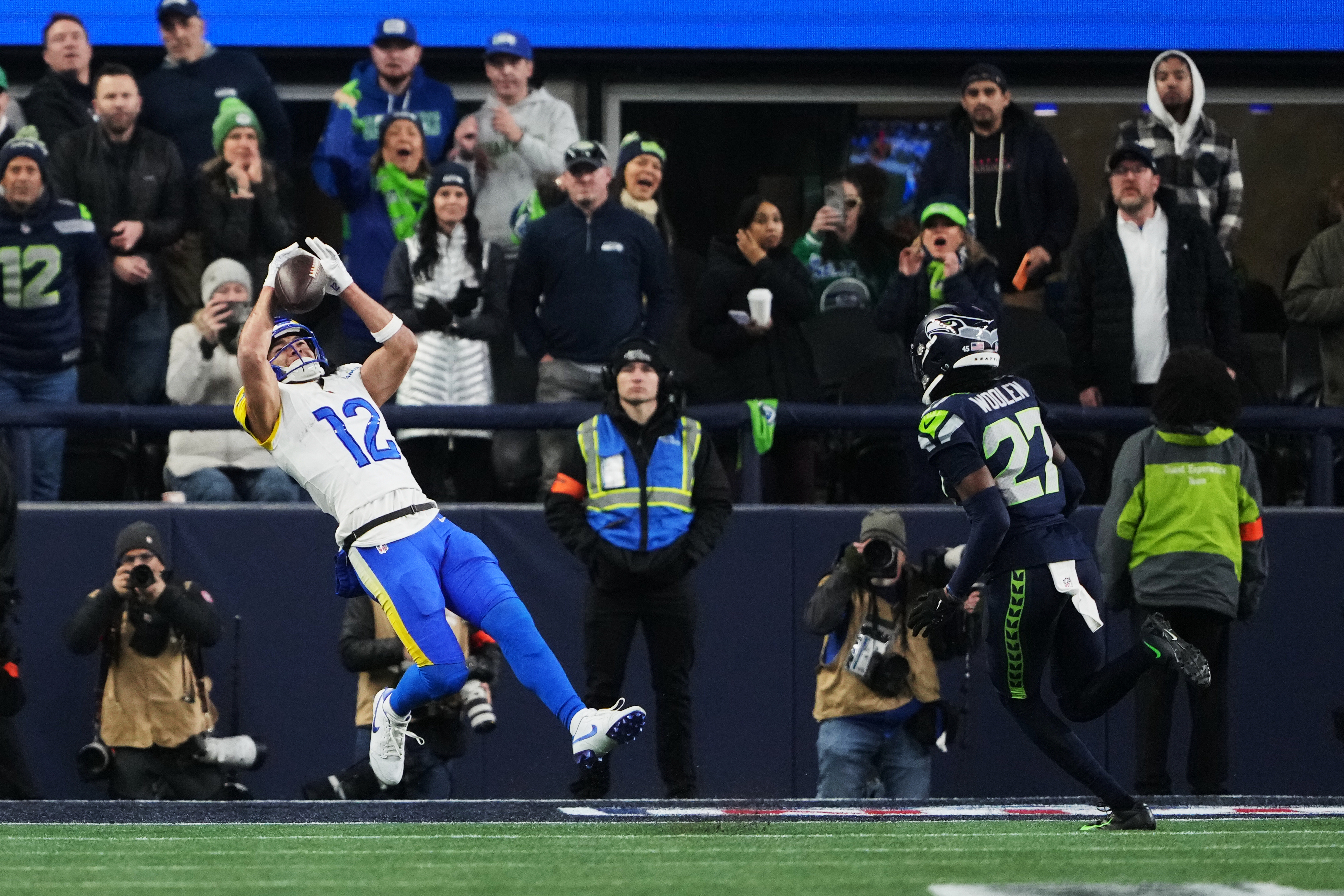Los Angeles Rams wide receiver Puka Nacua (12) makes a touchdown catch past Seattle Seahawks cornerback Riq Woolen (27) during the second half of the NFC Championship NFL football game Sunday, Jan. 25, 2026, in Seattle.