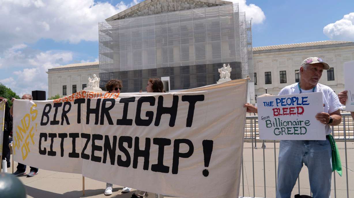 Demonstrators holds up a banner during a rally at the Supreme Court in Washington, May 15, 2025. A new poll shows mixed voter views on President Trump's first year back in office and finds substantial support among Utahns for birthright citizenship.