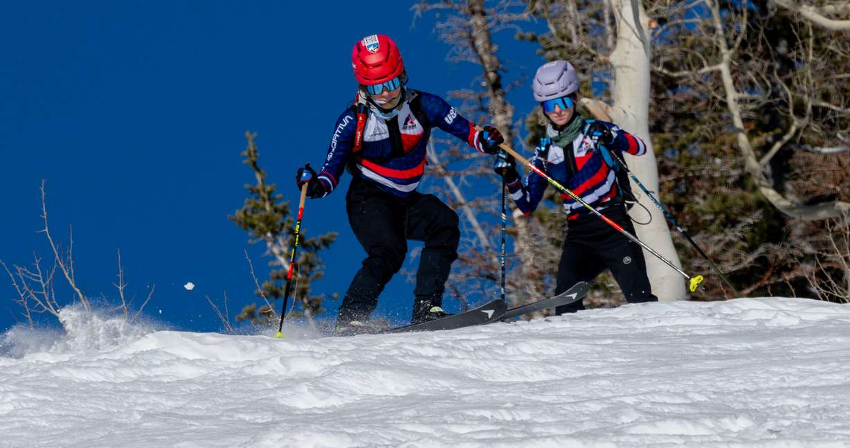 Skimo athletes Landon Jakob and McCall Birkinshaw begin a descent as they demonstrate the relatively new sport during a short workout in Alta on Tuesday.