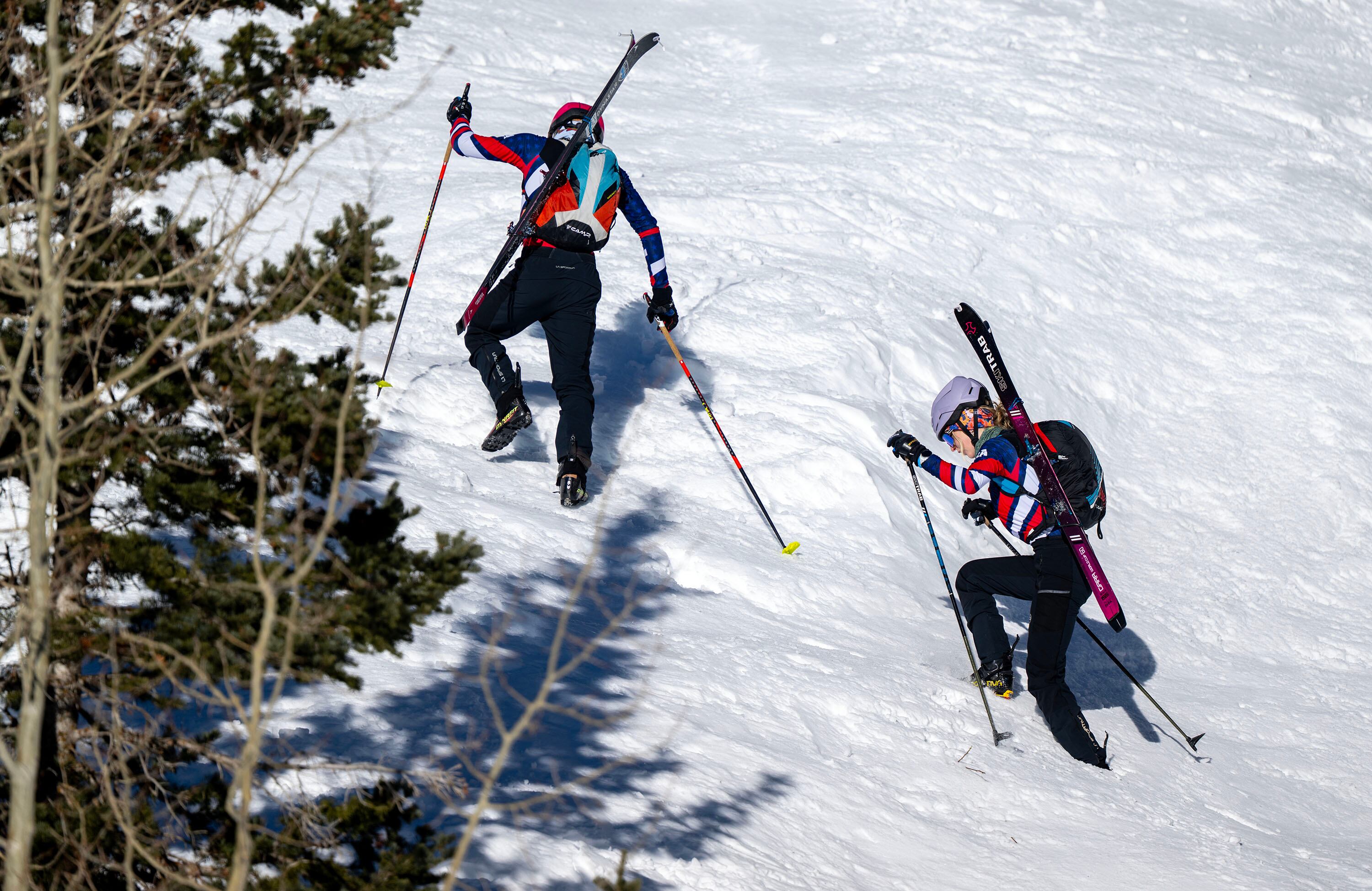 Skimo athletes Landon Jakob and McCall Birkinshaw climb up a snow face as they demonstrate the relatively new sport during a short workout in Alta on Tuesday.
