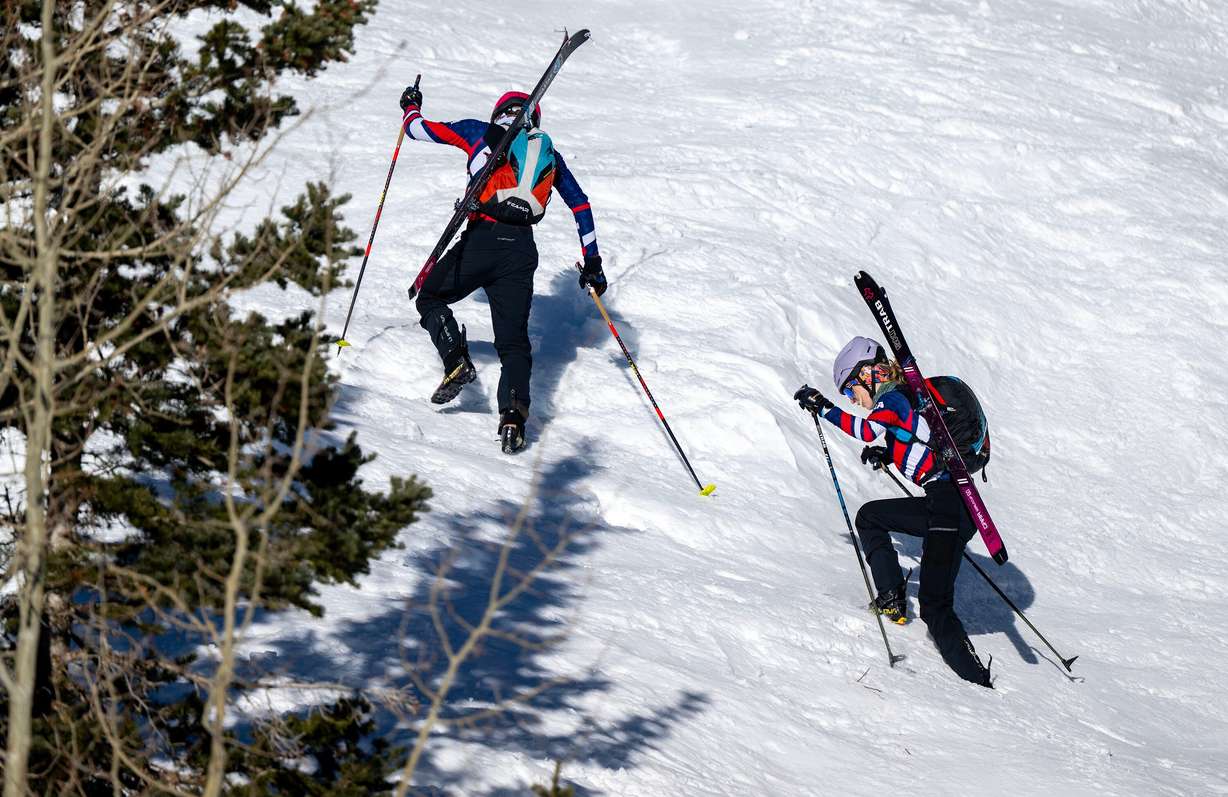Skimo athletes Landon Jakob and McCall Birkinshaw climb up a snow face as they demonstrate the relatively new sport during a short workout in Alta on Tuesday.