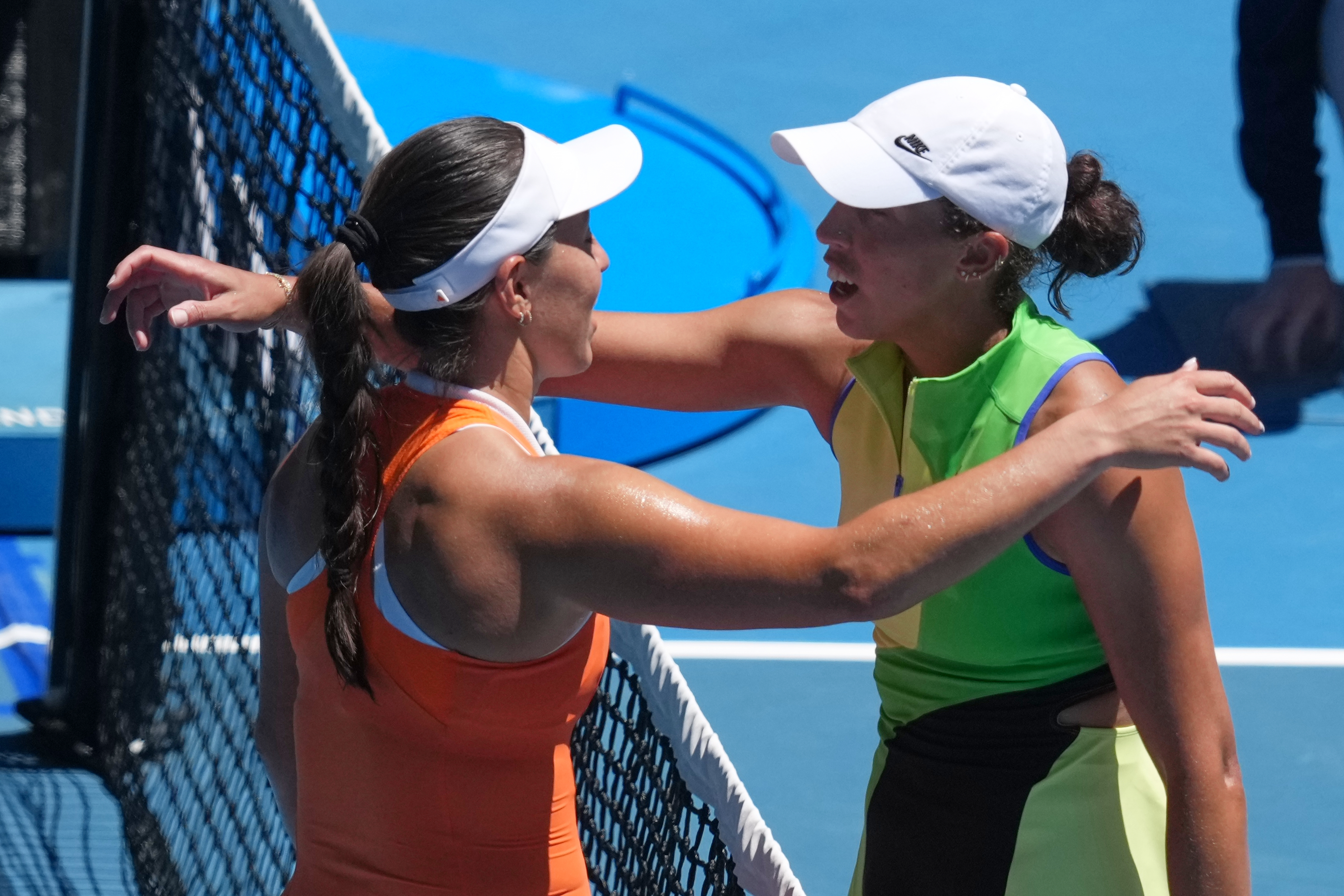 Jessica Pegula, left, of the U.S., is congratulated by her compatriot Madison Keys after winning their fourth round match at the Australian Open tennis championship in Melbourne, Australia, Monday, Jan. 26, 2026. 