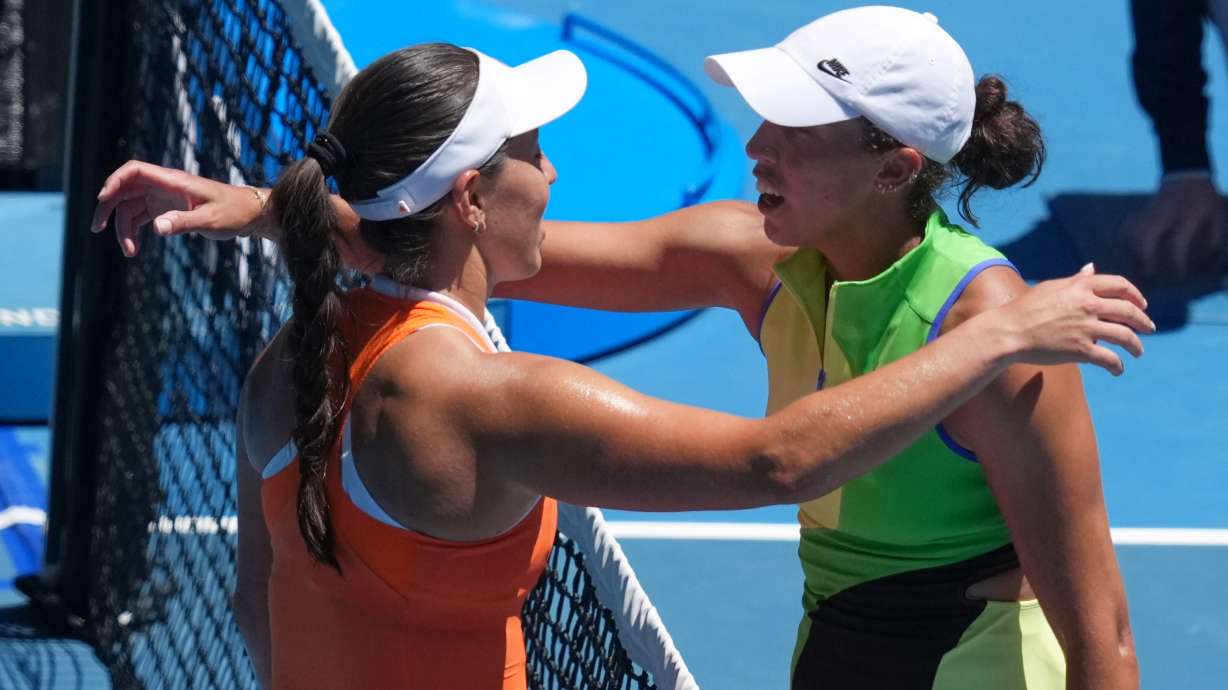 Jessica Pegula, left, of the U.S., is congratulated by her compatriot Madison Keys after winning their fourth round match at the Australian Open tennis championship in Melbourne, Australia, Monday, Jan. 26, 2026.