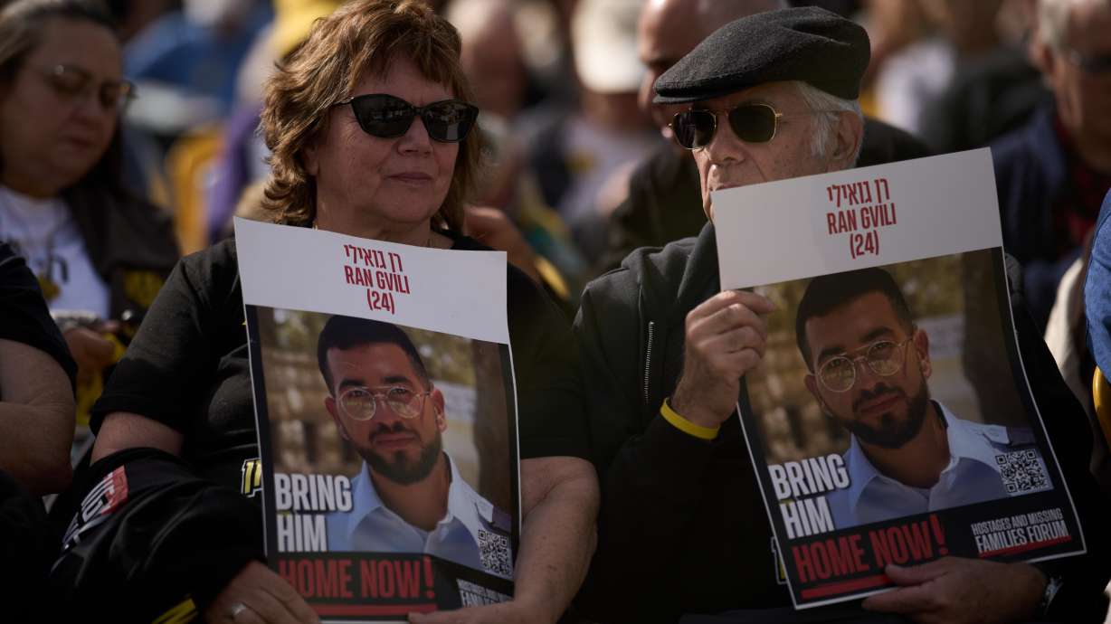 People hold signs with a photo of Ran Gvili, who was killed while fighting Hamas militants during the Oct. 7, 2023 attack and whose body has been held in Gaza ever since, during a rally calling for his return in Tel Aviv, Israel, Friday.