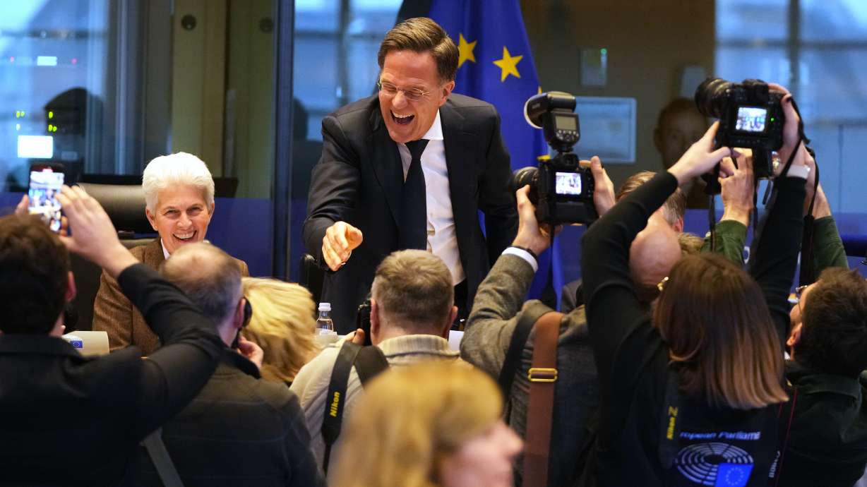 NATO Secretary General Mark Rutte, center, greets the audience prior to his address during the Security and Defense Committee at the European Parliament in Brussels, Monday.