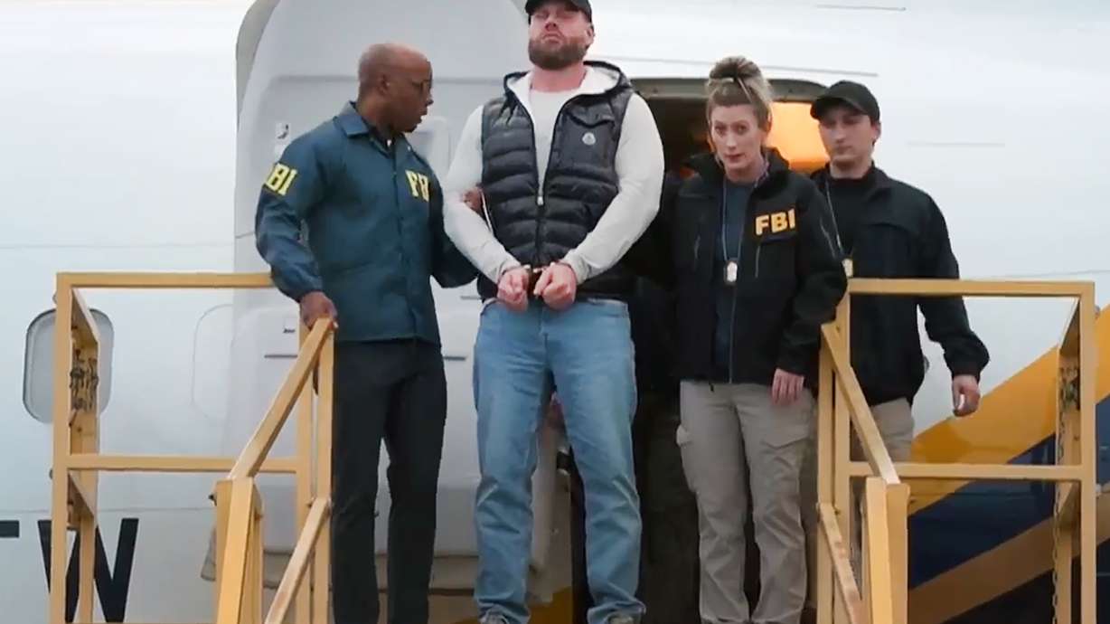This still photo taken from video and provided by the FBI shows Ryan Wedding a former Canadian Olympic snowboarder facing charges related to drug trafficking and the killing of a federal witness is taken off a plane at Ontario International Airport in Ontario, Calif. on Friday, Jan. 23, 2026.