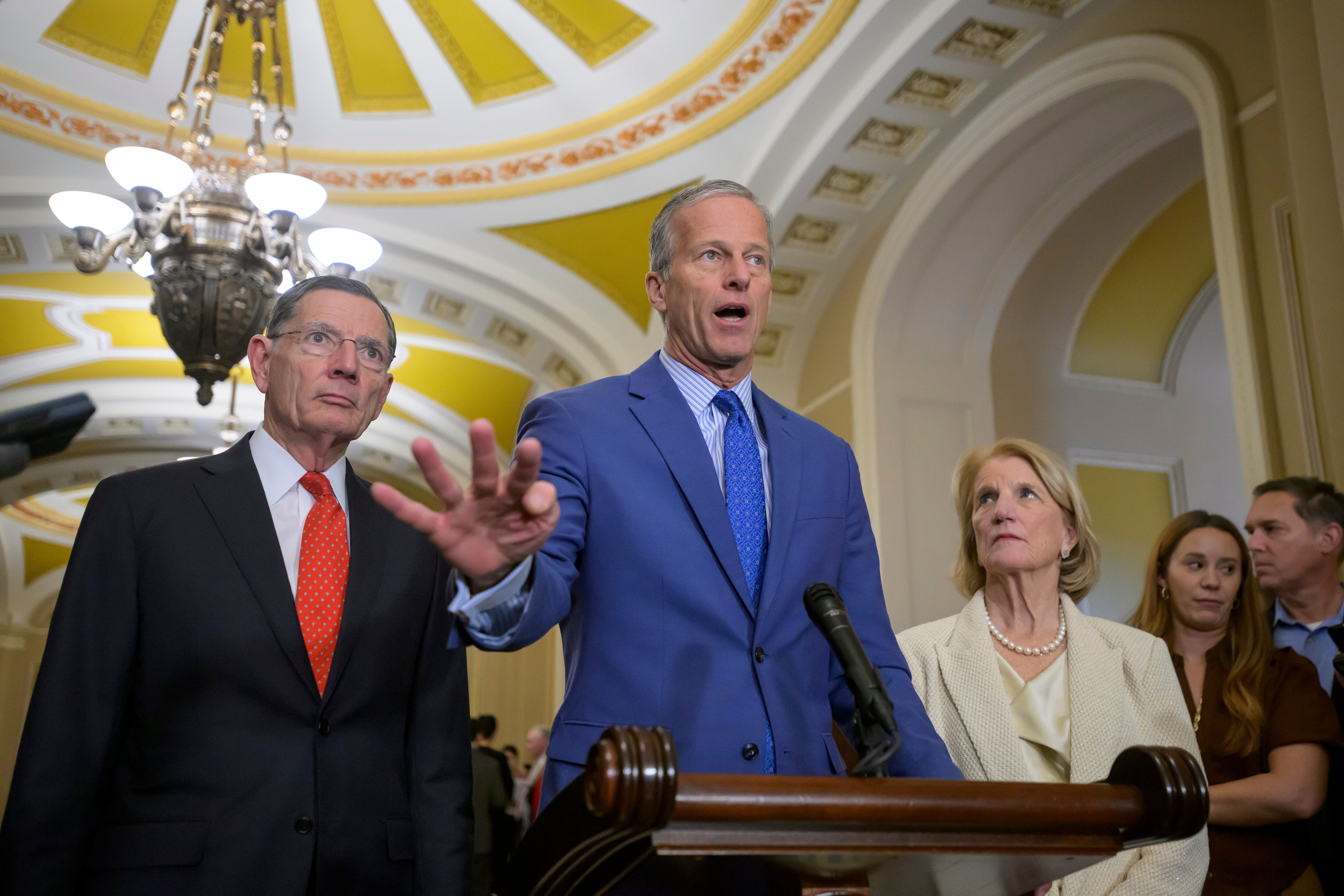 Senate Majority Leader John Thune, R-S.D., center, is joined by Sen. John Barrasso, R-Wyo., left, and Sen. Shelley Moore Capito, R-W.Va., right, during a news conference at the Capitol, Jan. 13, in Washington.