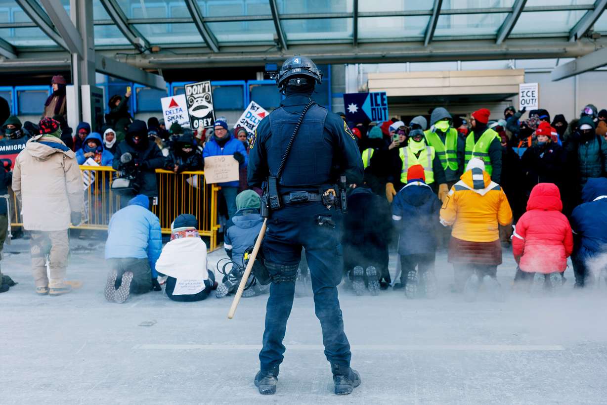 Clergy members and community activists gather at the Minneapolis-St. Paul International Airport to protest deportation flights and urge airlines to call for an end to the Department of Homeland Security's operation on Friday, in St. Paul, Minn.