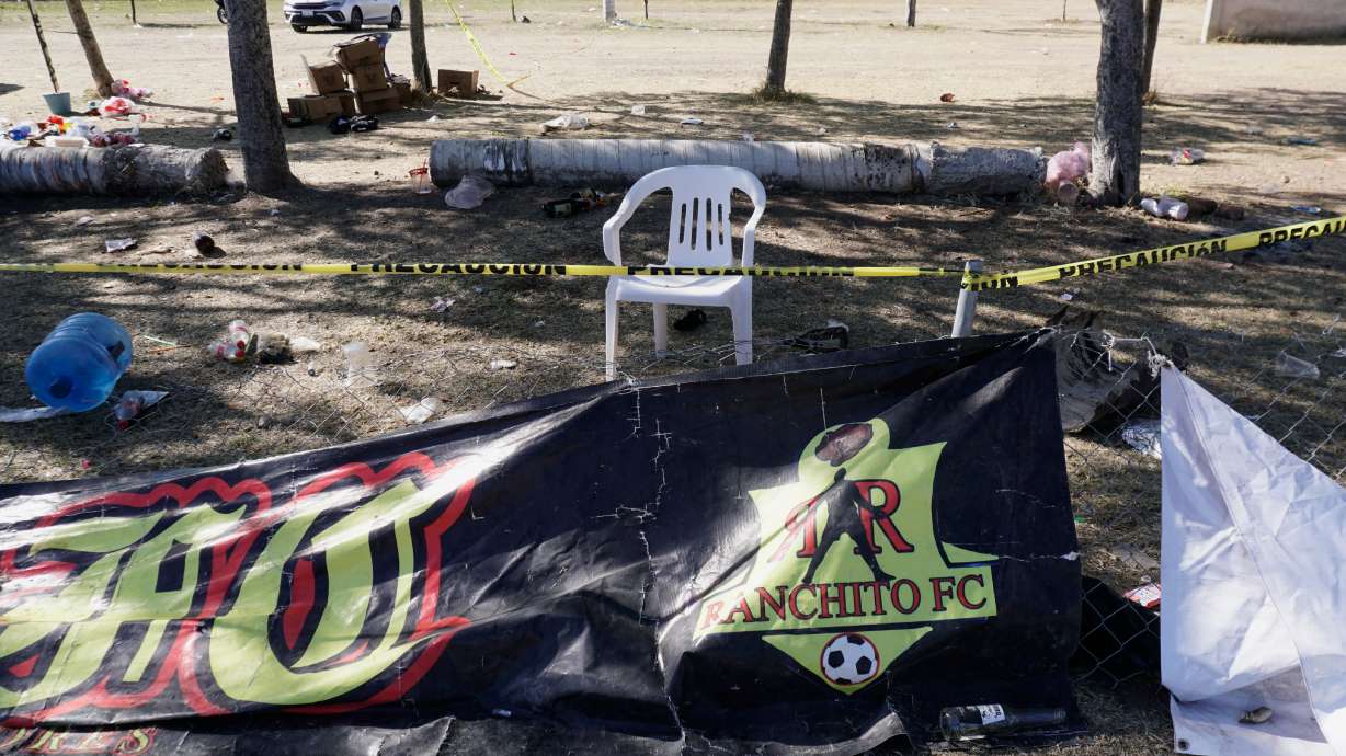 Crime scene tape surrounds a soccer field the day after gunmen opened fire, killing and wounding people, in Salamanca, Mexico, Monday, Jan. 26, 2026.