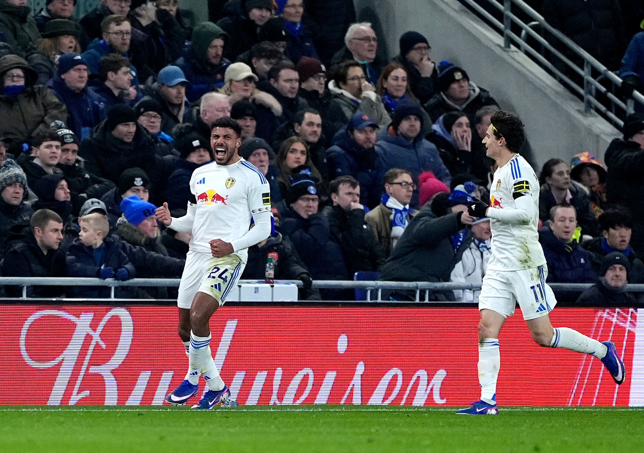 Leeds United's James Justin, left, celebrates scoring during the English Premier League soccer match between Everton and Leeds United in Liverpool, England, Monday Jan. 26, 2026. 