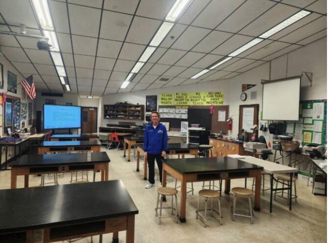 Alan Southern poses in his classroom.