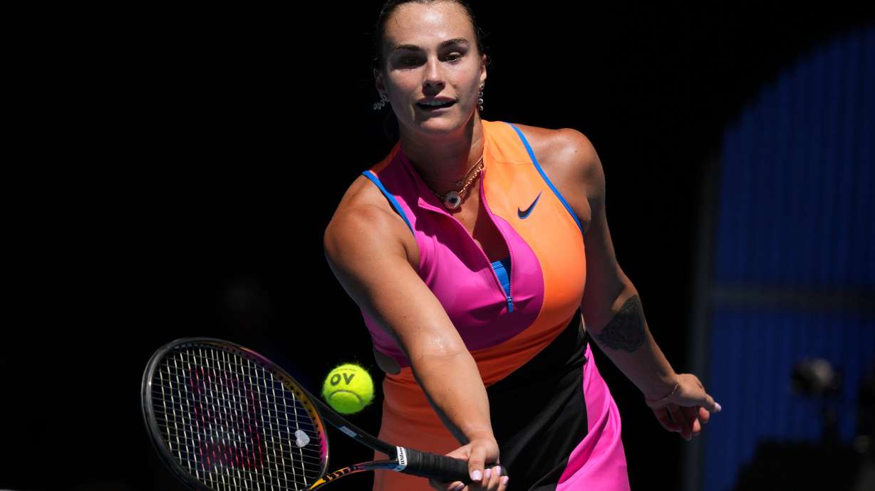 Aryna Sabalenka of Belarus plays a forehand return to Iva Jovic of the U.S. during their quarterfinal match at the Australian Open tennis championship in Melbourne, Australia, Tuesday, Jan. 27, 2026.