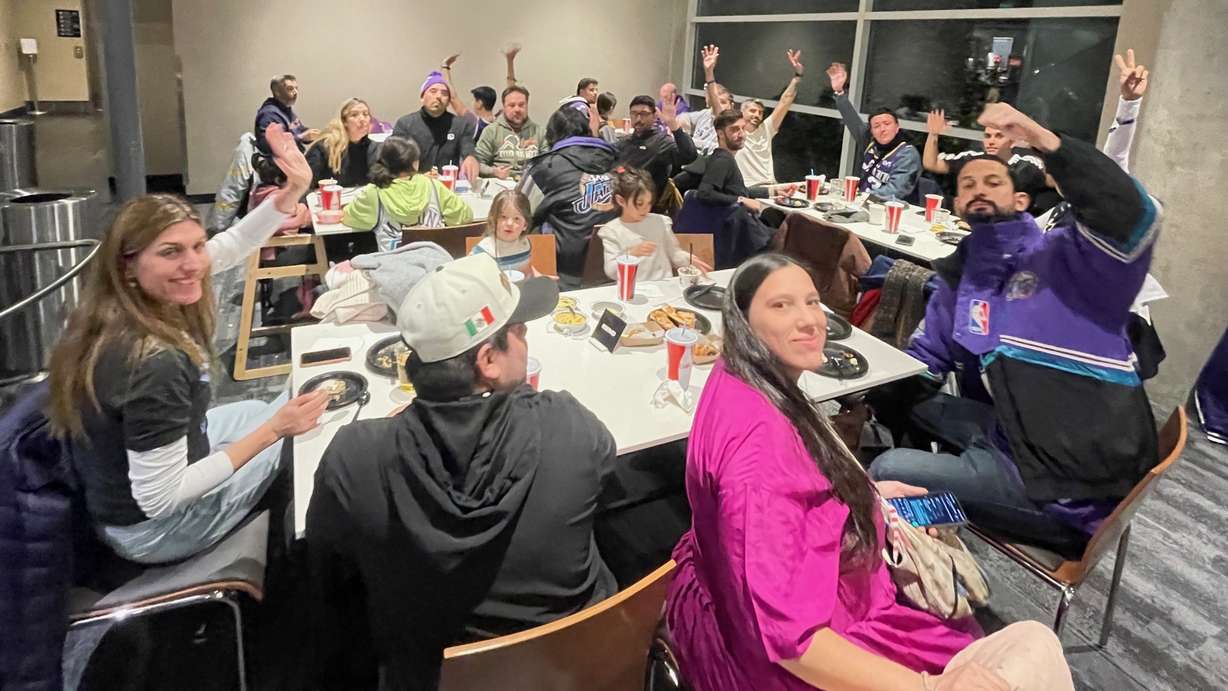 The contingent of Utah Jazz fans that came from South America to see the basketball team in action is pictured at the Delta Center in Salt Lake Center before the team's game on Saturday.