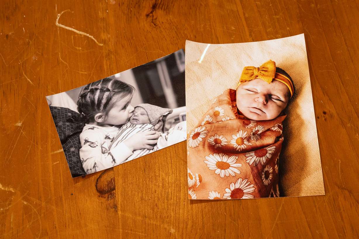 Family photos of the two children the Goodwins lost, son JR (or Little Jeff) Goodwin (January 2019) and daughter Amber Rae Goodwin (November 2020), within hours of their births, after both were born with no kidneys. They were told it wouldn't happen twice. The Goodwins posed for photos at home in Bountiful on Saturday.