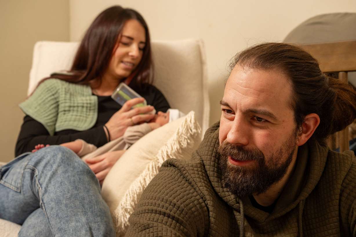 Bre Goodwin feeds newborn son Vincent Golden Goodwin as Jeff Goodwin talks as they pose for photos along with their 9-year-old daughter Murphy Goodwin in Bountiful on Saturday, Jan. 24, 2026. The Goodwins lost two babies, son JR (or Little Jeff) Goodwin (January 2019) and daughter Amber Rae Goodwin (November 2020), within hours of their births after both were born with no kidneys. They were told it wouldn't happen twice.
