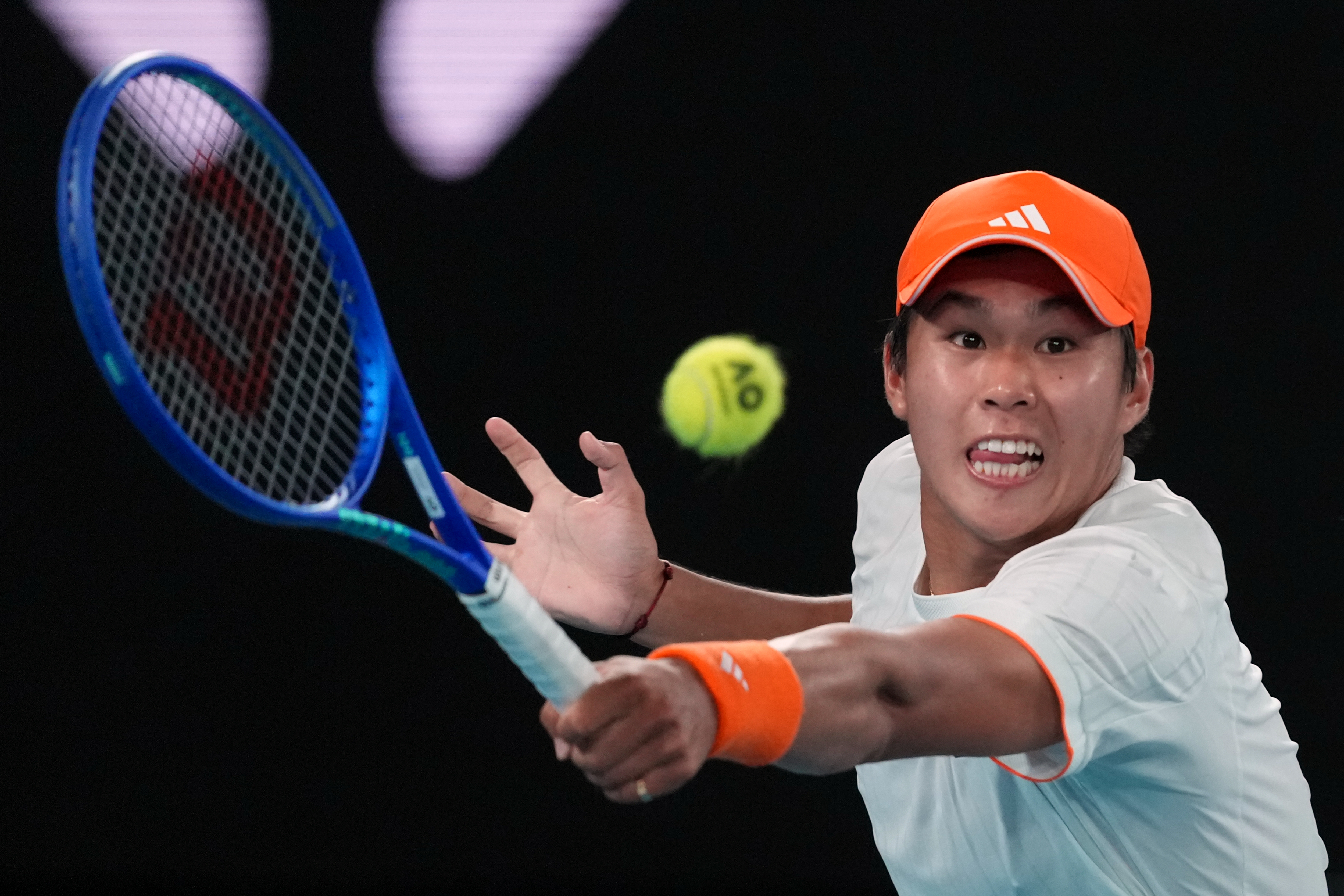 Learner Tien of the U.S. plays a backhand return to Alexander Zverev of Germany during their quarterfinal match at the Australian Open tennis championship in Melbourne, Australia, Tuesday, Jan. 27, 2026. 