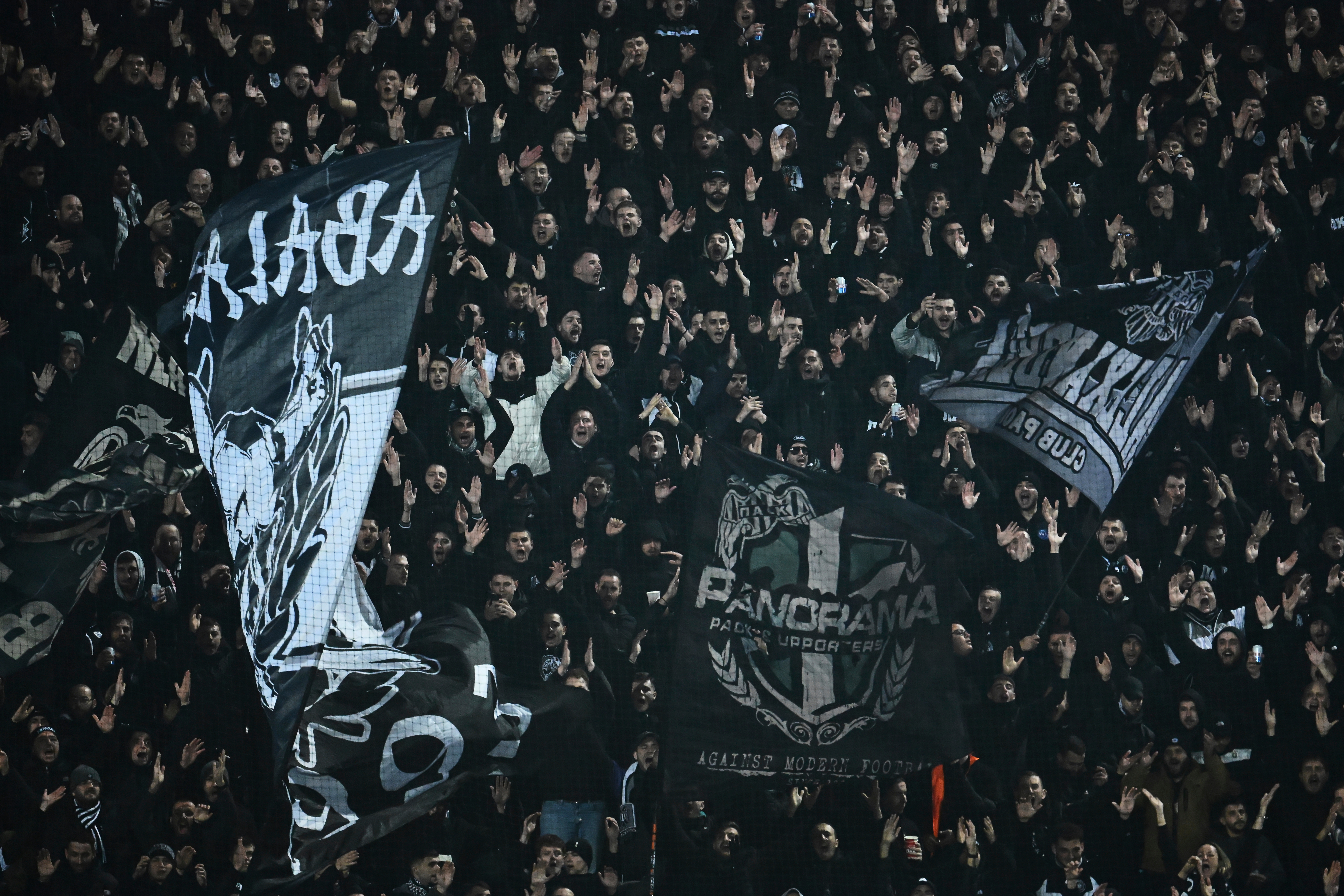 PAOK's fans wave giant flags of their team during the Europa League soccer match between PAOK and Real Betis in Thessaloniki, Greece, Thursday, Jan. 22, 2026. 