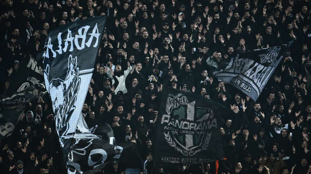 PAOK's fans wave giant flags of their team during the Europa League soccer match between PAOK and Real Betis in Thessaloniki, Greece, Thursday, Jan. 22, 2026.