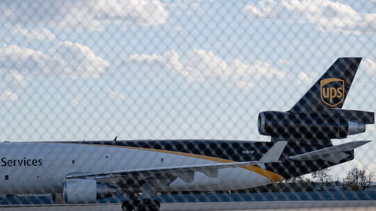 An MD-11F is seen parked at the UPS north maintenance hangar, Nov. 8, in Louisville, Ky. UPS announced Tuesday it was retiring its fleet of MD-11Fs following a deadly crash involving the aircraft.