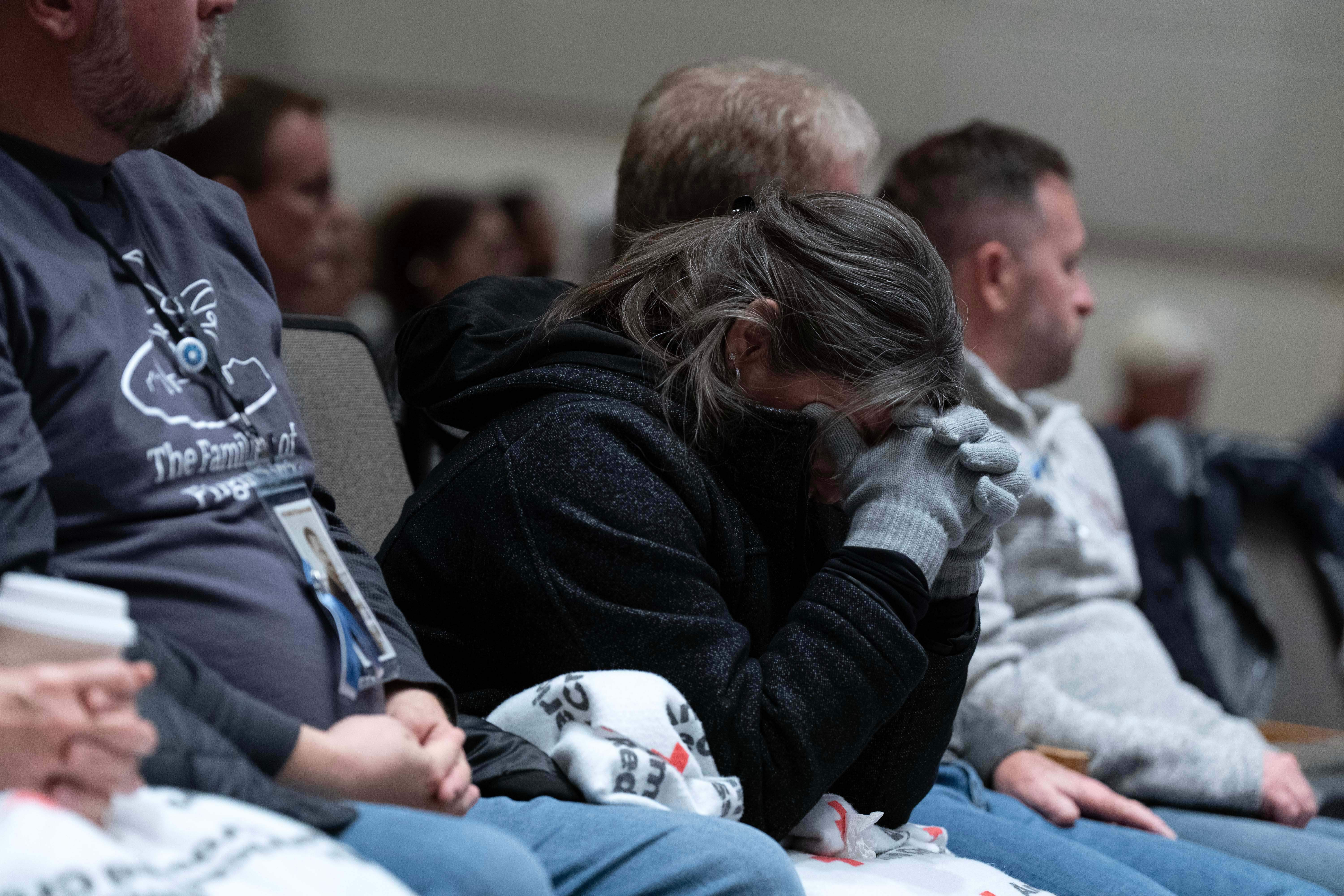 People attend the National Transportation Safety Board hearing on the January 2025 midair aircraft collision that killed 67 people near Reagan Airport, in Washington, Tuesday. Families of those killed are hoping for meaningful changes from the NTSB's recommendations.