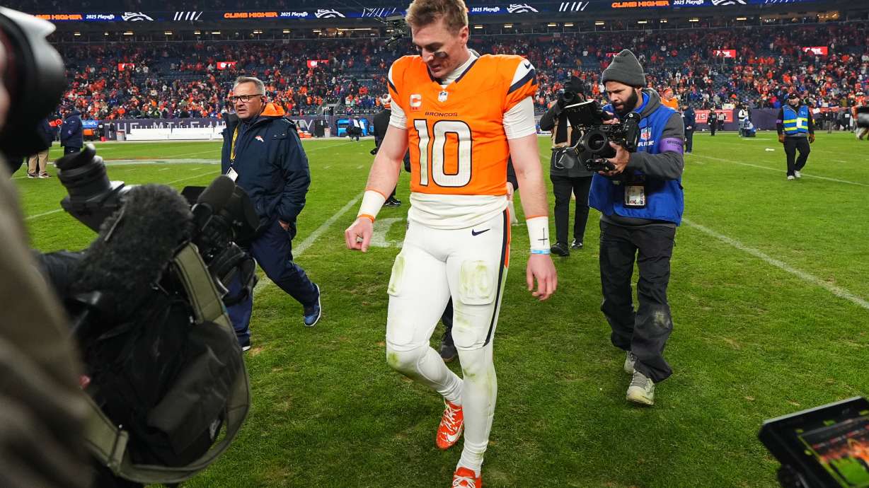 Denver Broncos quarterback Bo Nix leaves the field after an NFL divisional round playoff football game against the Buffalo Bills, Saturday, Jan. 17, 2026, in Denver.