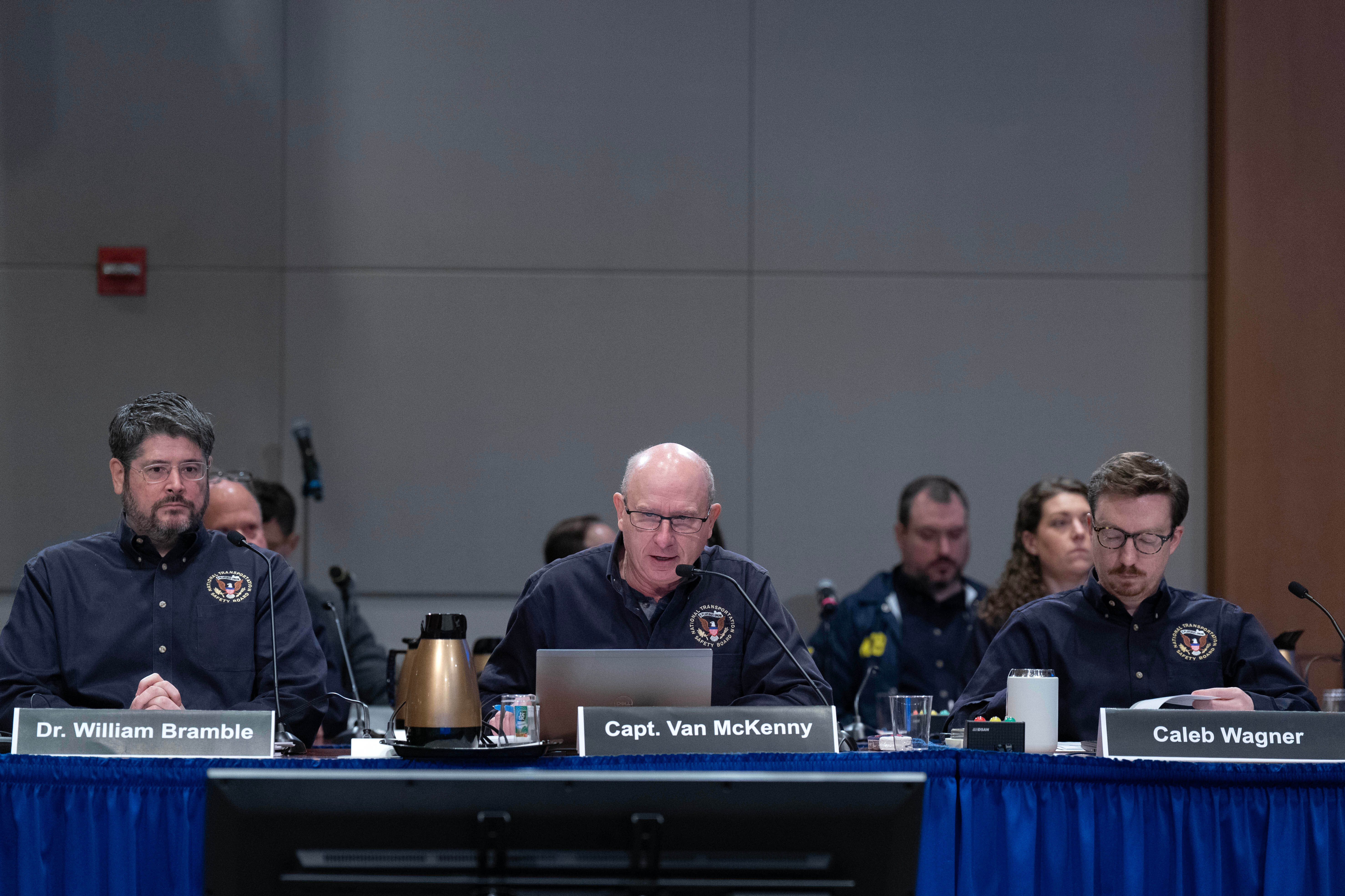 National Transportation Safety Board investigators William Bramble, and, from left, Capt. Van McKenny and Caleb Wagner speak during the hearing on the January 2025 midair aircraft collision that killed 67 people near Reagan Airport in Washington, Tuesday. Investigators said warning signs about safety were present long before the crash.