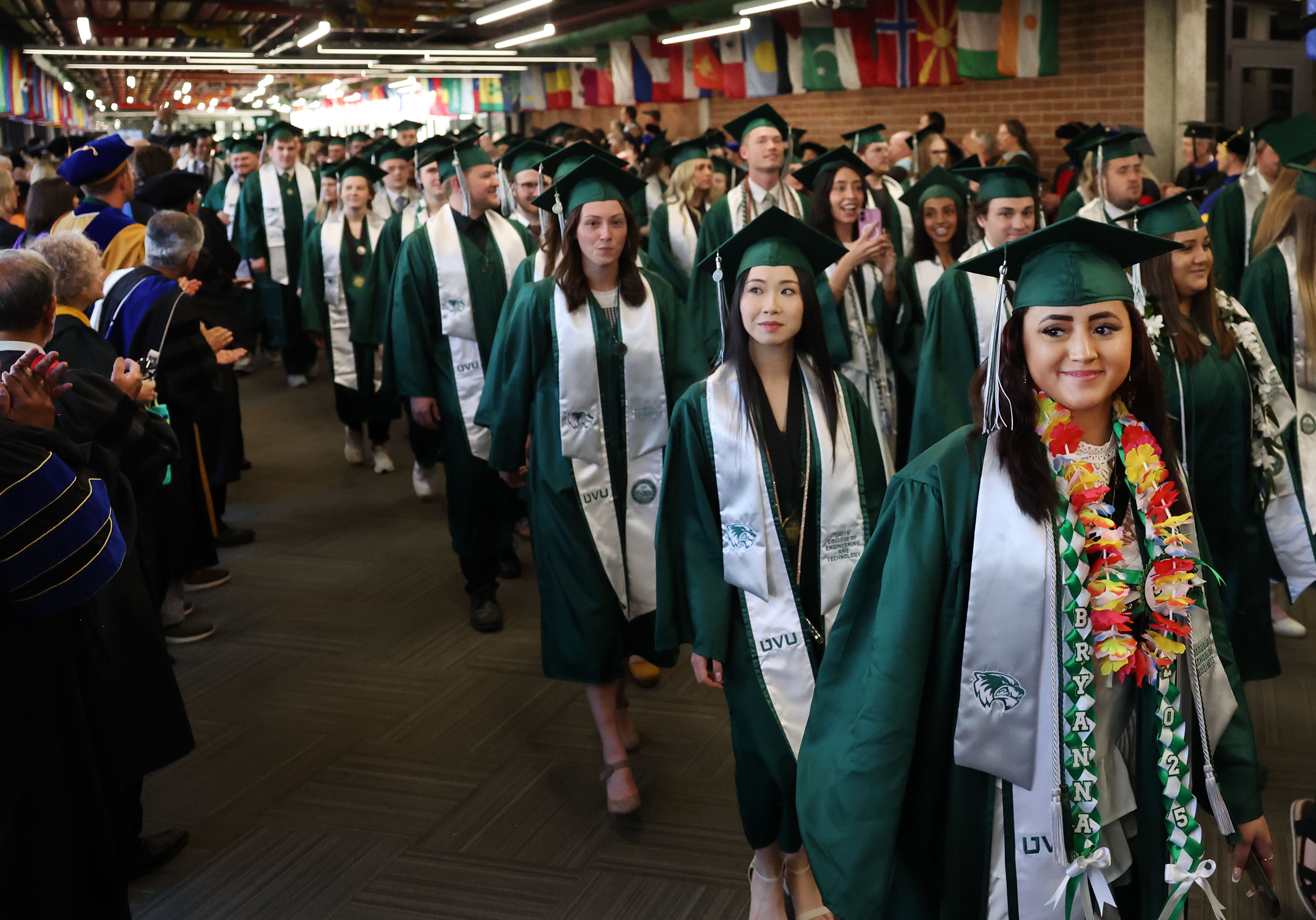 Utah Valley University students walk to the 2025 commencement ceremony in the UCCU Center at Utah Valley University in Orem on April 30, 2025.