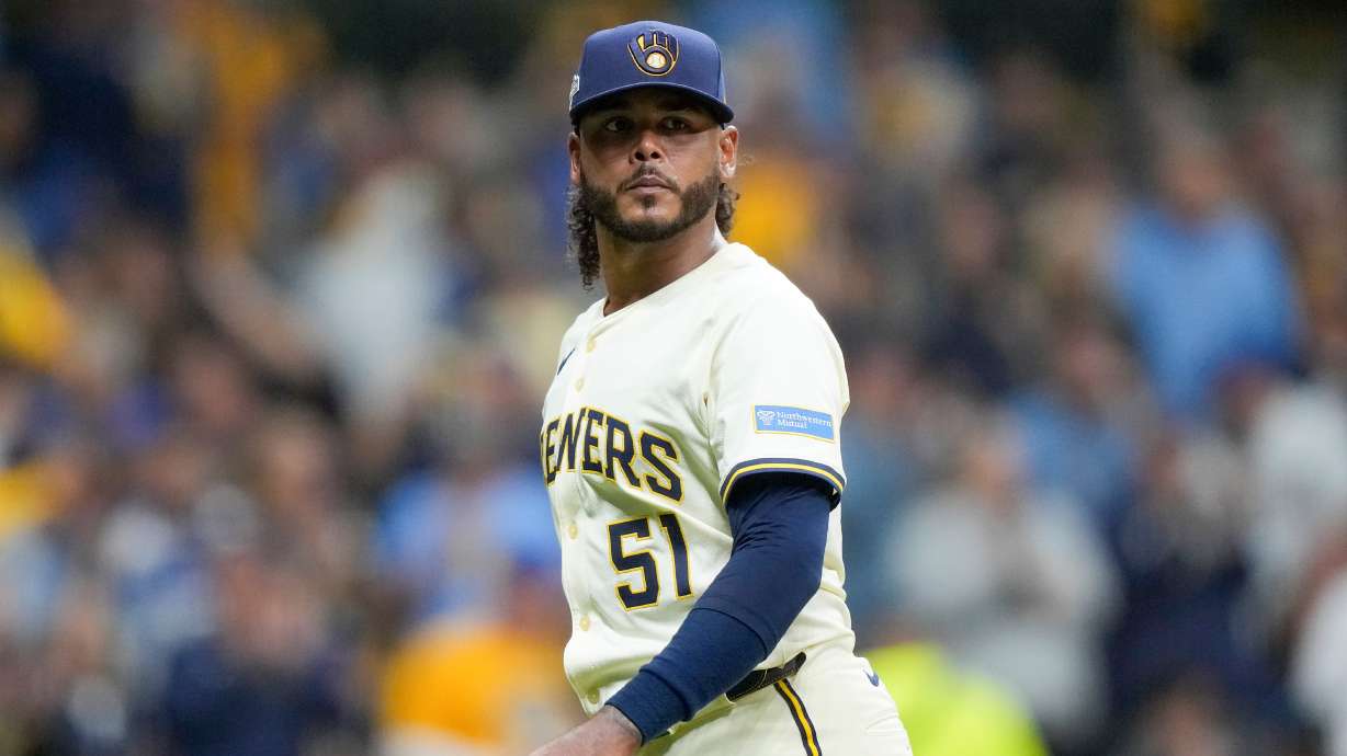 FILE - Milwaukee Brewers pitcher Freddy Peralta walks to the dugout after the top of the fifth inning in Game 2 of baseball's National League Championship Series against the Los Angeles Dodgers, Oct. 14, 2025, in Milwaukee.