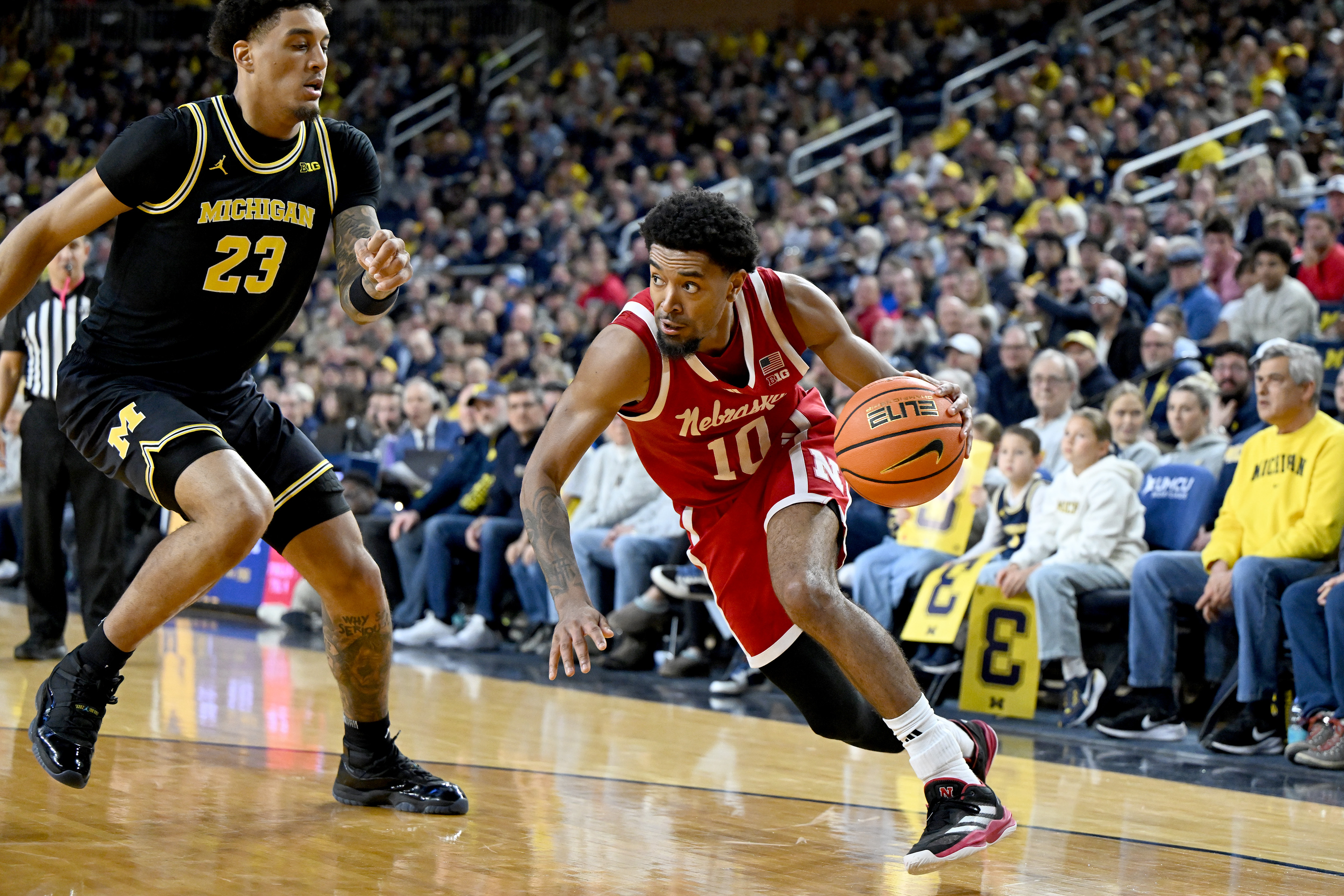 Nebraska guard Jamarques Lawrence (10) drives the baseline against Michigan forward Yaxel Lendeborg (23) in the first half of an NCAA college basketball game in Ann Arbor, Mich., Tuesday, Jan. 27, 2026. 