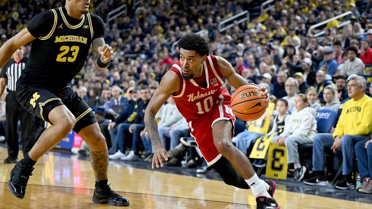Nebraska guard Jamarques Lawrence (10) drives the baseline against Michigan forward Yaxel Lendeborg (23) in the first half of an NCAA college basketball game in Ann Arbor, Mich., Tuesday, Jan. 27, 2026.