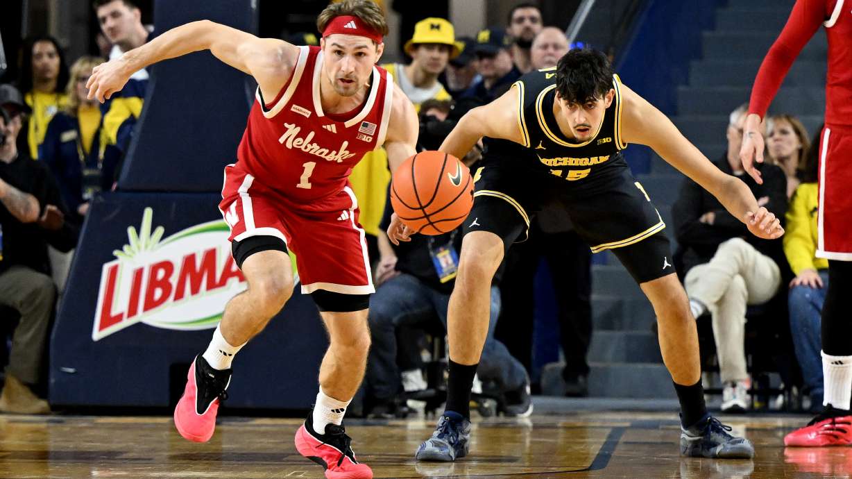 Nebraska guard Sam Hoiberg (1) steals the ball from Michigan center Aday Mara (15) in the first half of an NCAA college basketball game in Ann Arbor, Mich., Tuesday, Jan. 27, 2026.