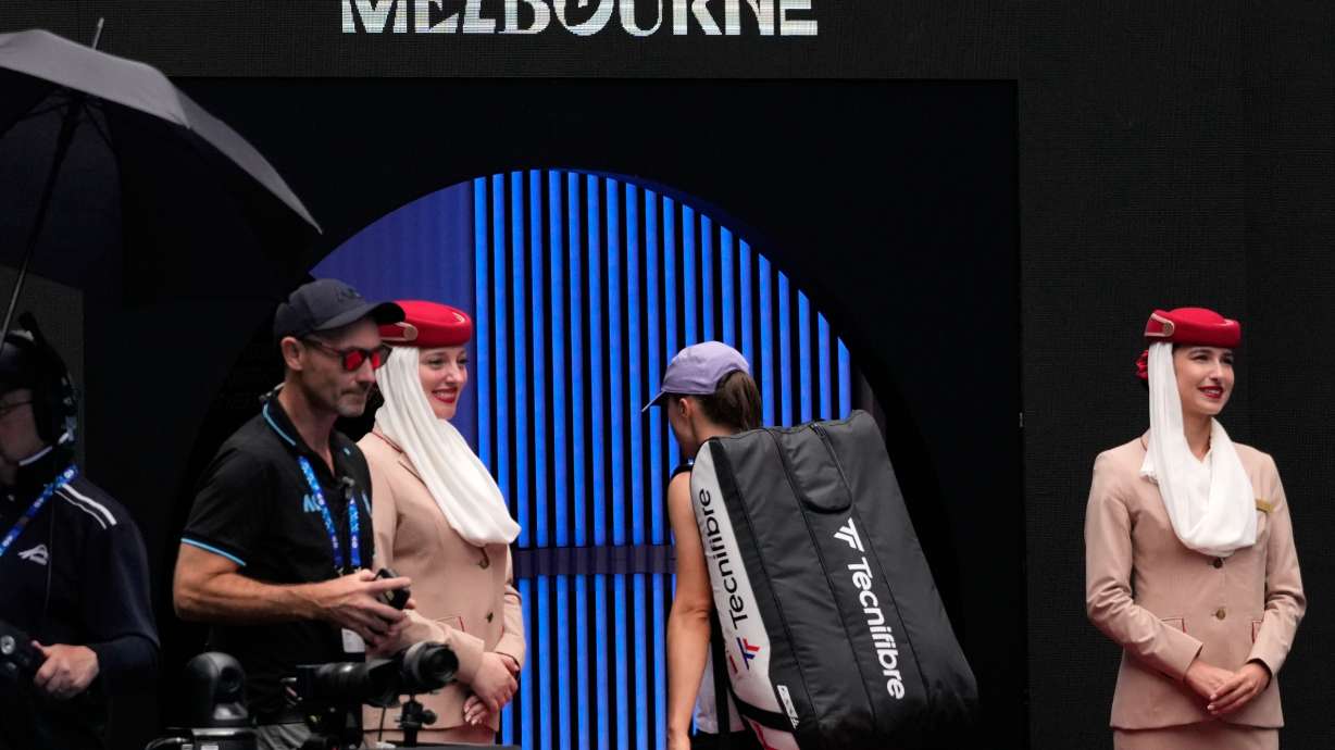 Iga Swiatek of Poland walks from the court following her quarterfinal loss to Elena Rybakina of Kazakhstan at the Australian Open tennis championship in Melbourne, Australia, Wednesday, Jan. 28, 2026.