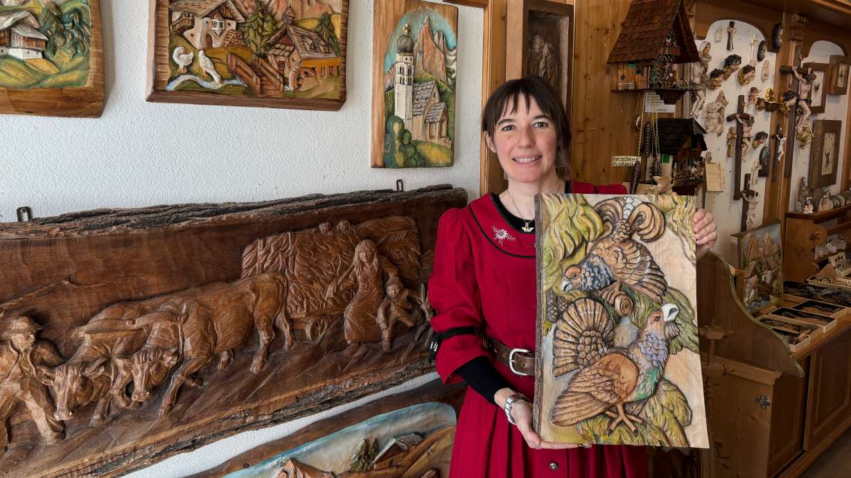 Jasmine Feuchter poses for a photo in a traditional craft shop in San Vigilio di Marebbe, northern Italy, Monday, Jan. 26, 2026.