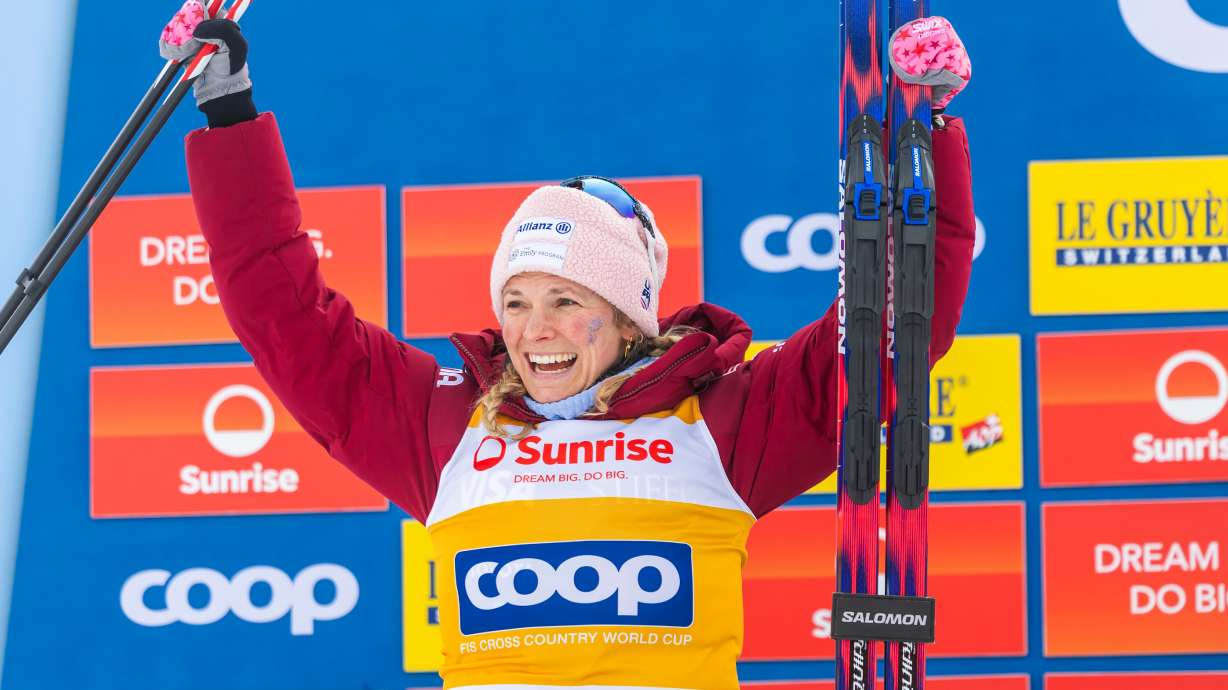 Second placed Jessie Diggins of United States celebrates on the podium after the women's 20km mass start classic skiing race, at the FIS Cross-Country World Cup at the Nordic Center Goms, in Geschinen, Switzerland, Sunday, Jan. 25, 2026.