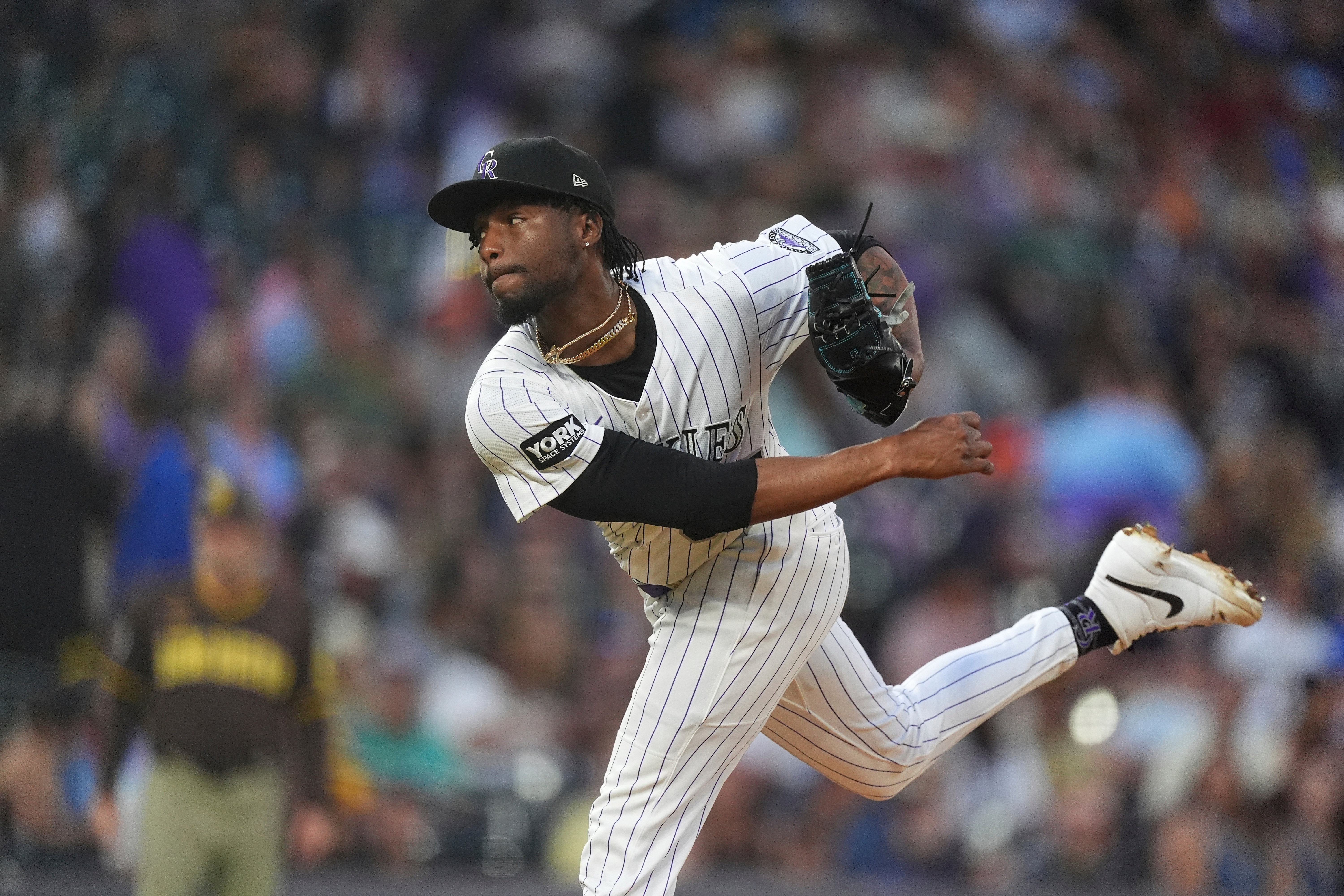 FILE - Colorado Rockies relief pitcher Angel Chivilli (57) in the fourth inning of a baseball game, Sept. 6, 2025, in Denver. 
