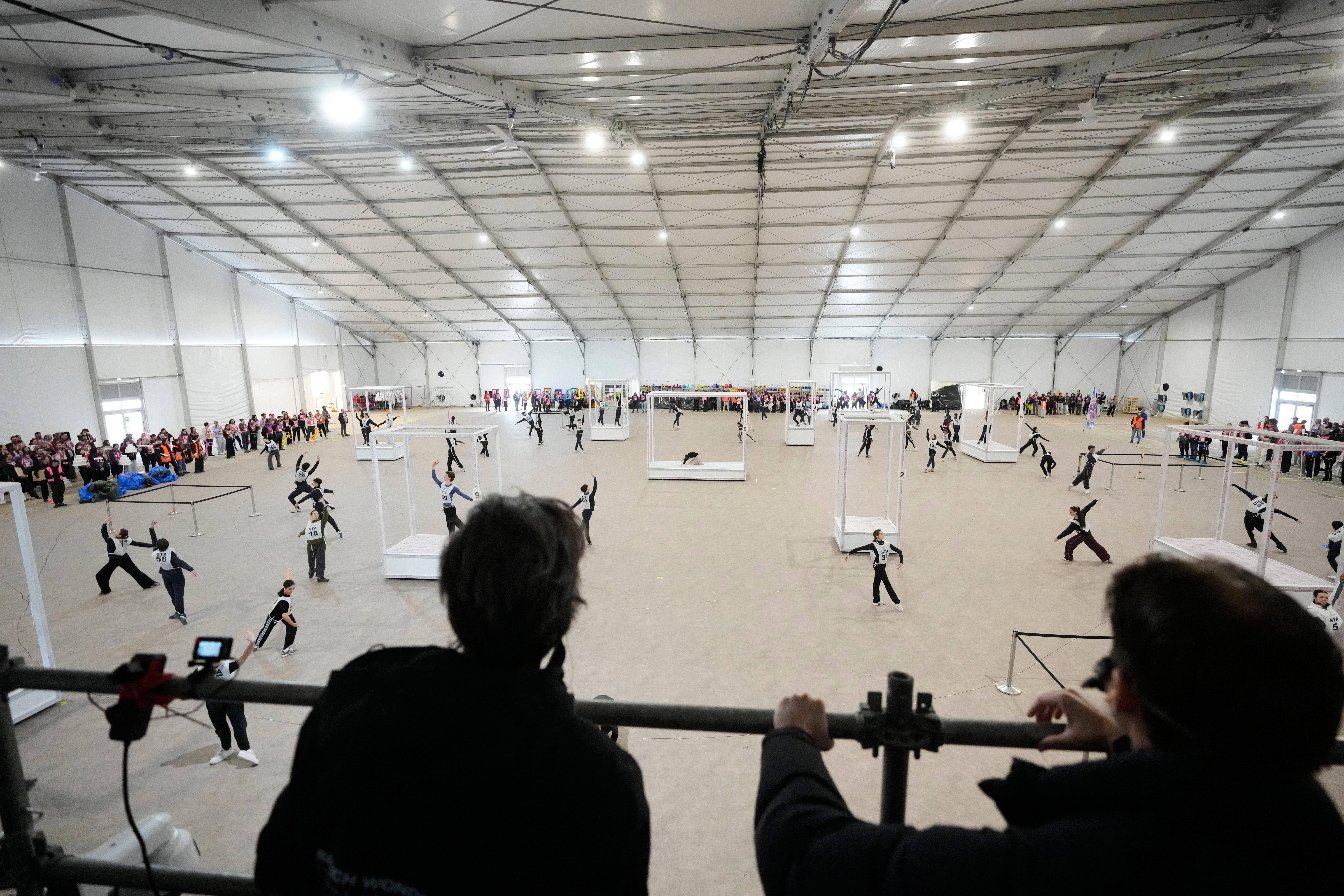 Volunteer dancers perform during rehearsals for the opening ceremony of the Milan Cortina 2026 Winter Olympic Games, at a compound in a big tent next to San Siro Stadium, in Milan, Italy, Saturday, Jan. 24, 2026. 