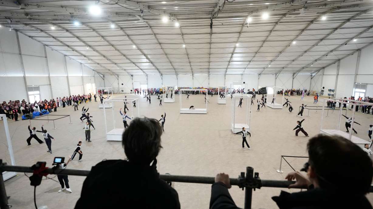 Volunteer dancers perform during rehearsals for the opening ceremony of the Milan Cortina 2026 Winter Olympic Games, at a compound in a big tent next to San Siro Stadium, in Milan, Italy, Saturday, Jan. 24, 2026.