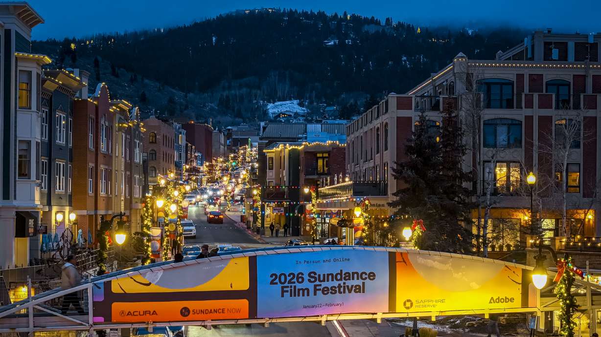 Signage for the Sundance Film Festival along Main Street in Park City on Jan. 2. A head programmer at Sundance reflects on the impact the city has had on the festival.