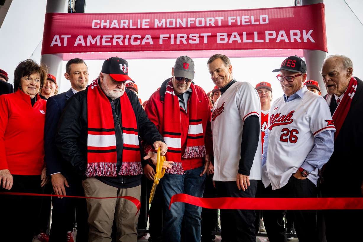 Thayne Shaffer, president and CEO of America First Credit Union, center left, and Charlie Monfort, center right, cut the ribbon during the Charlie Monfort Field at America First Ballpark grand opening and ribbon-cutting ceremony in Salt Lake City on Wednesday, Jan. 28, 2026.