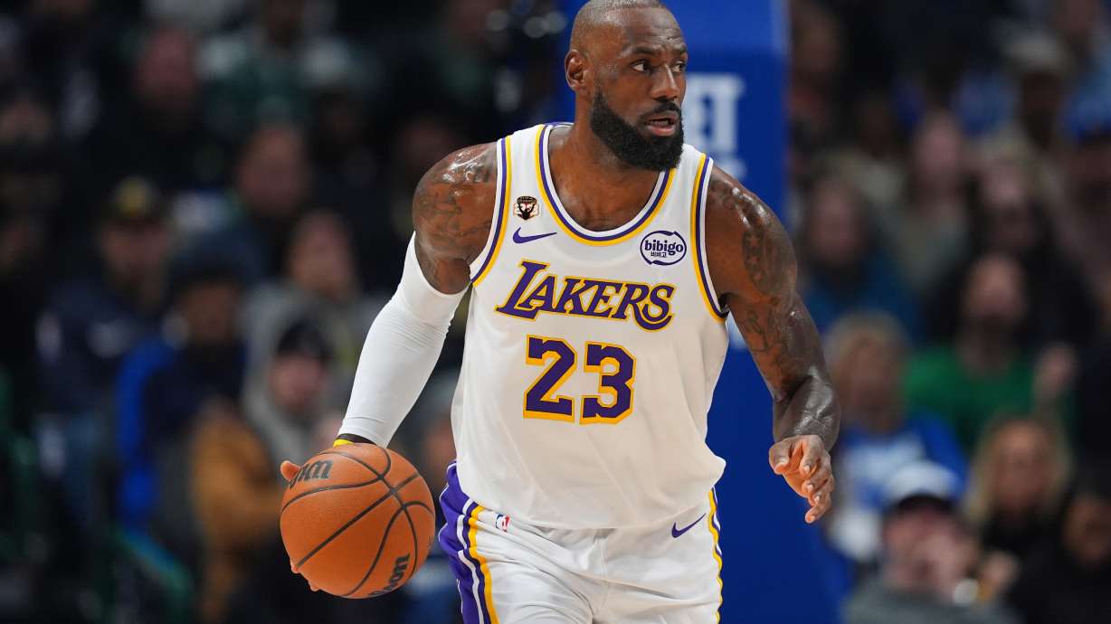 Los Angeles Lakers forward LeBron James dribbles the ball up court against the Dallas Mavericks during the first half of an NBA basketball game Saturday, Jan. 24, 2026, in Dallas.