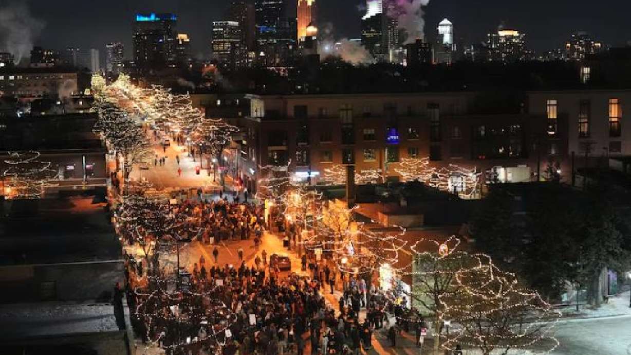 People gather during a vigil for 37-year-old Alex Pretti, who was fatally shot by a U.S. Border Patrol officer earlier in the day, Saturday, in Minneapolis.