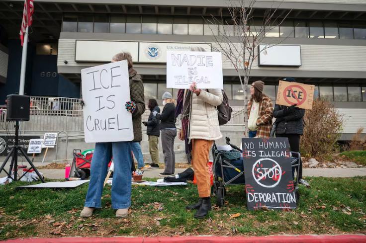 Protesters gather in front of the U.S. Citizenship and Immigration Services field office in Salt Lake City on Dec. 8, 2025.