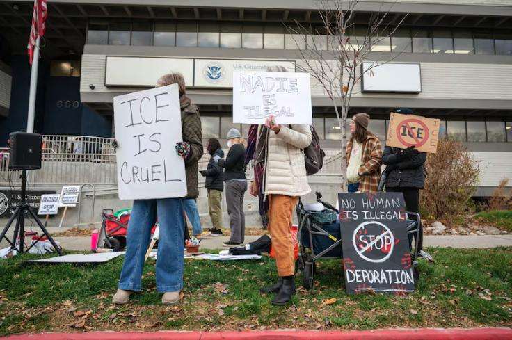 Protesters gather in front of the U.S. Citizenship and Immigration Services field office in Salt Lake City on Dec. 8, 2025.