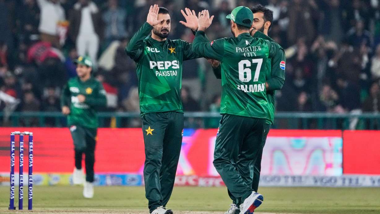 Pakistan's Abrar Ahmed, left, celebrates with teammates after the dismissal of Australia's Cooper Connolly during the first T20 cricket match between Pakistan and Australia, in Lahore, Pakistan, Thursday, Jan. 29, 2026.