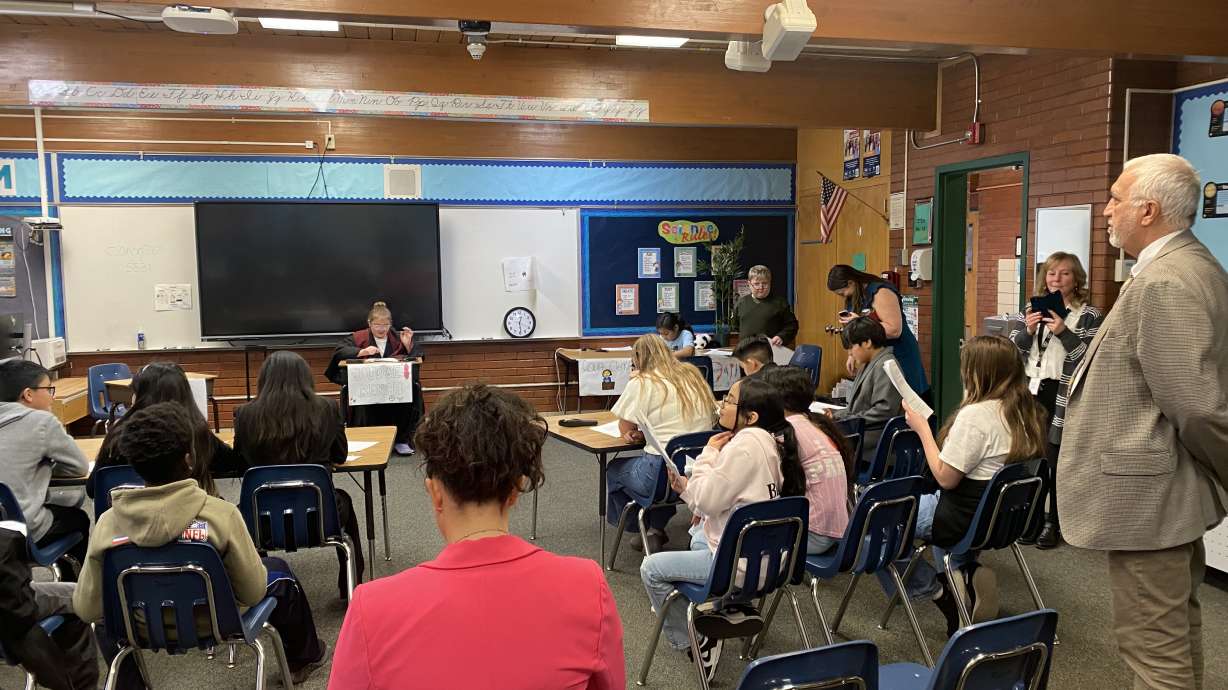 Salt Lake County District Attorney Sim Gill observes a mock trial with fifth-grade students from David Gourley Elementary School on Wednesday, part of an 18-week program teaching the children about the criminal justice system.