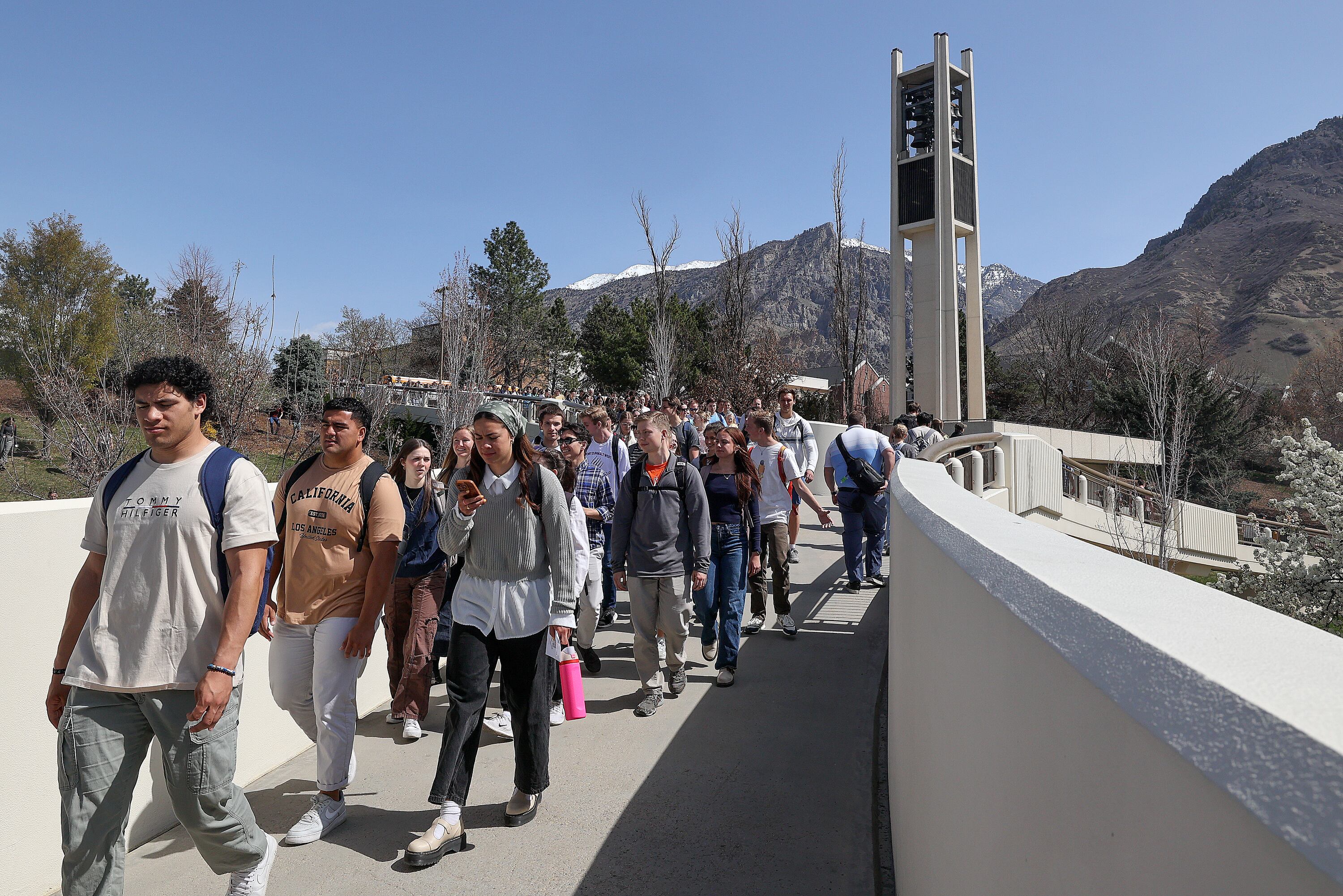 People walk through the campus of Brigham Young University in Provo on April 8, 2025.