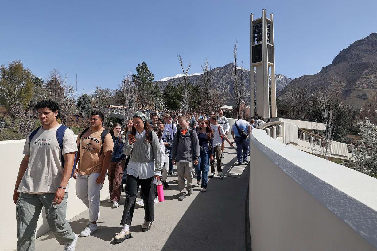 People walk through the campus of Brigham Young University in Provo on April 8, 2025.