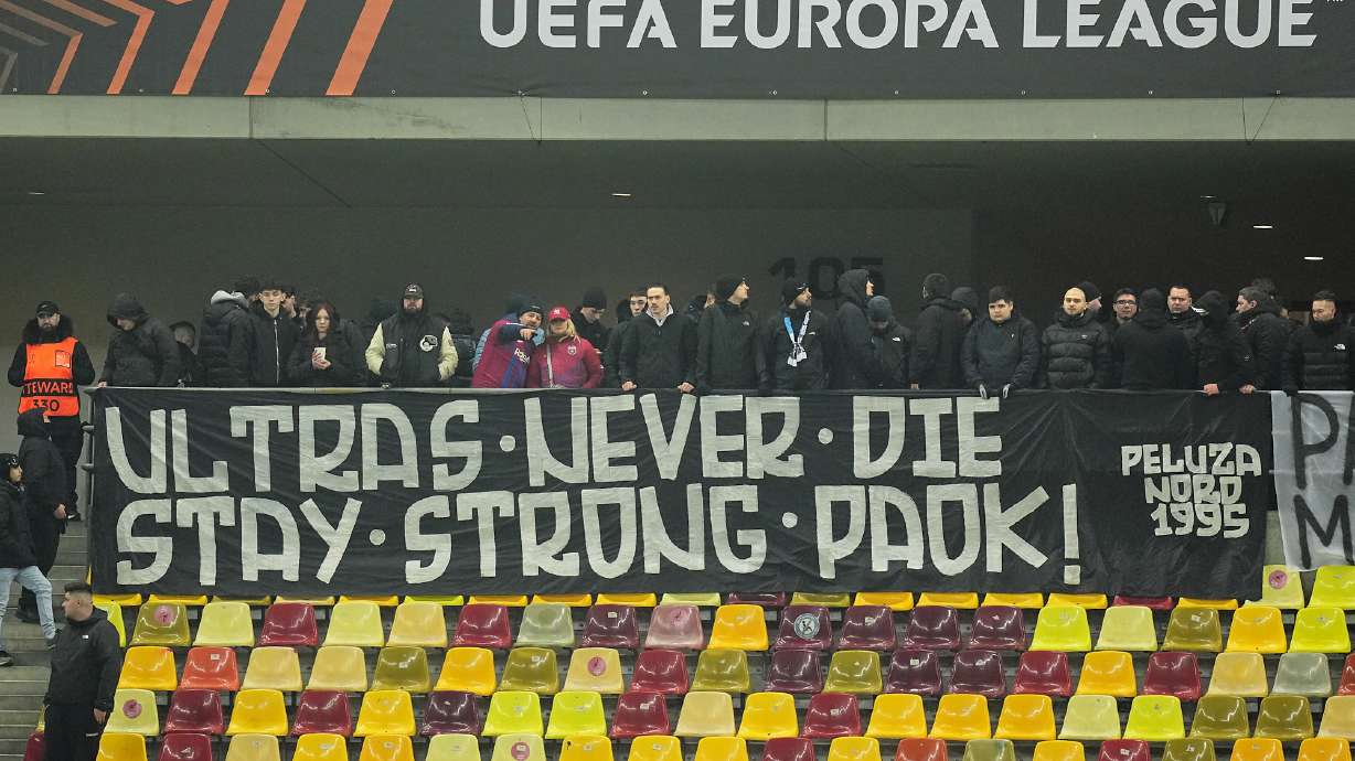 FCSB fans display a banner in memory of the seven Greek PAOK fans killed in a car crash in Romania ahead of the Europa League soccer match between FCSB and Fenerbahce in Bucharest, Thursday, Jan. 29, 2026.
