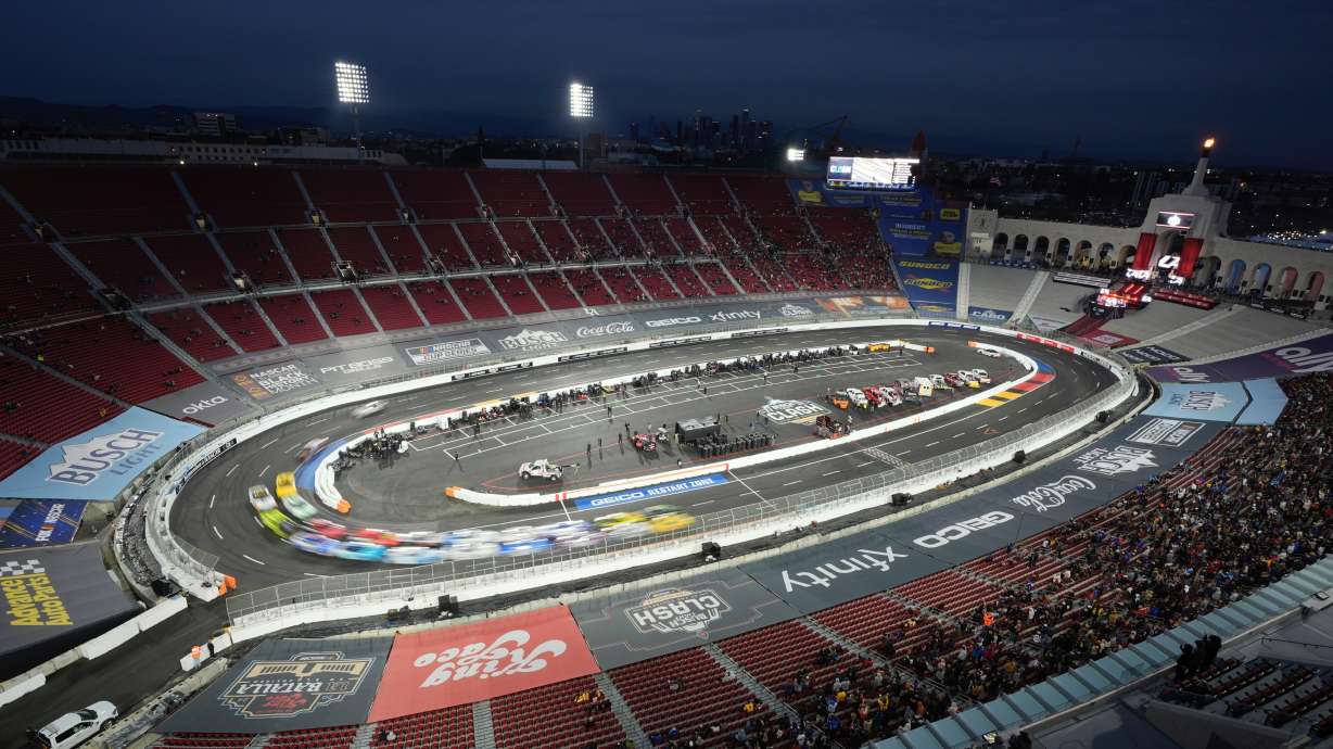 FILE - Cars race during the Busch Light Clash NASCAR exhibition auto race at Los Angeles Memorial Coliseum, Feb. 3, 2024, in Los Angeles.