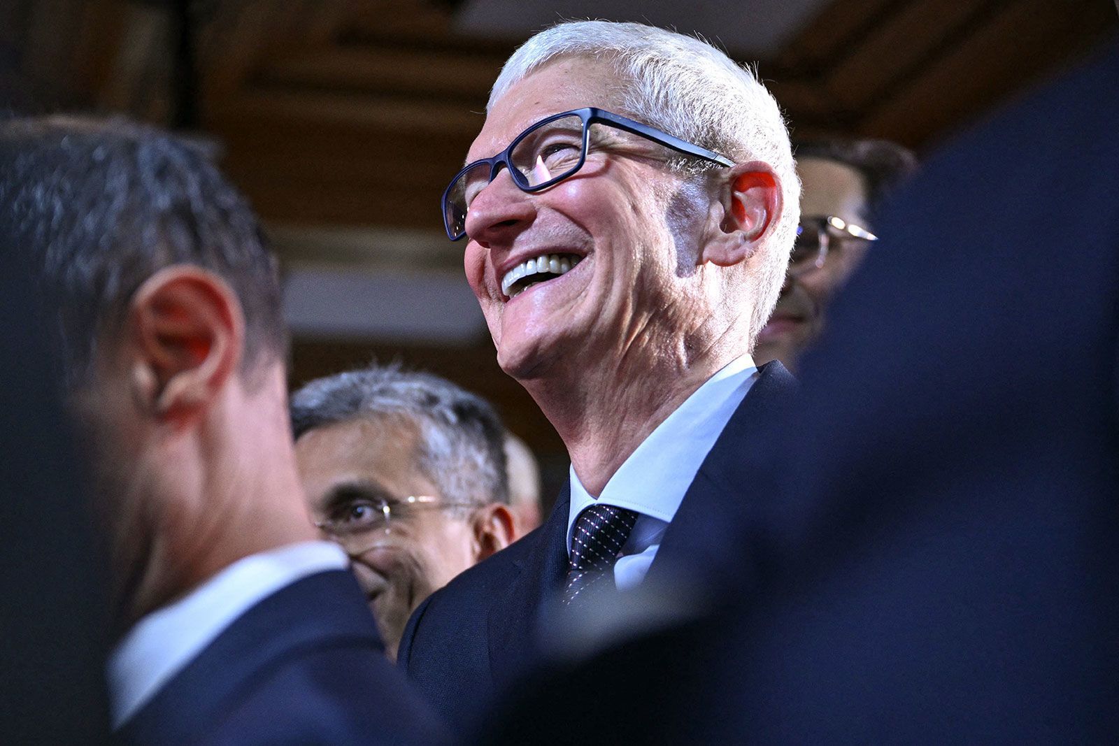 Apple CEO Tim Cook attends the World Economic Forum's annual meeting in Davos, Switzerland, on Jan. 21. Apple reported earnings that blew past Wall Street's expectations on Thursday, largely driven by the iPhone 17.
